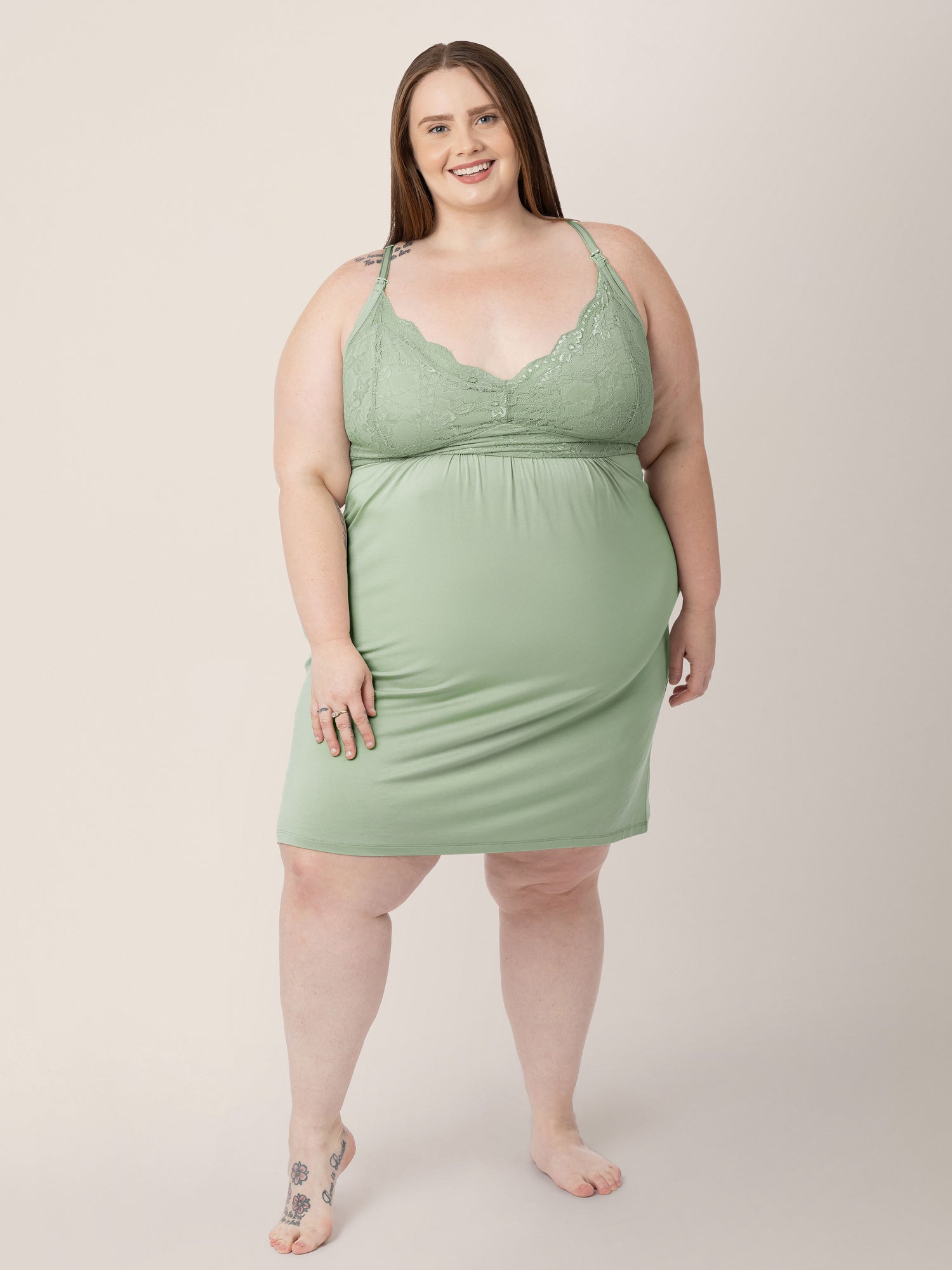 Model wearing the Lucille Maternity & Nursing Nightgown in Pistachio with her hands at her sides. @model_info:Hayley is 5'7" and wearing a 1X.