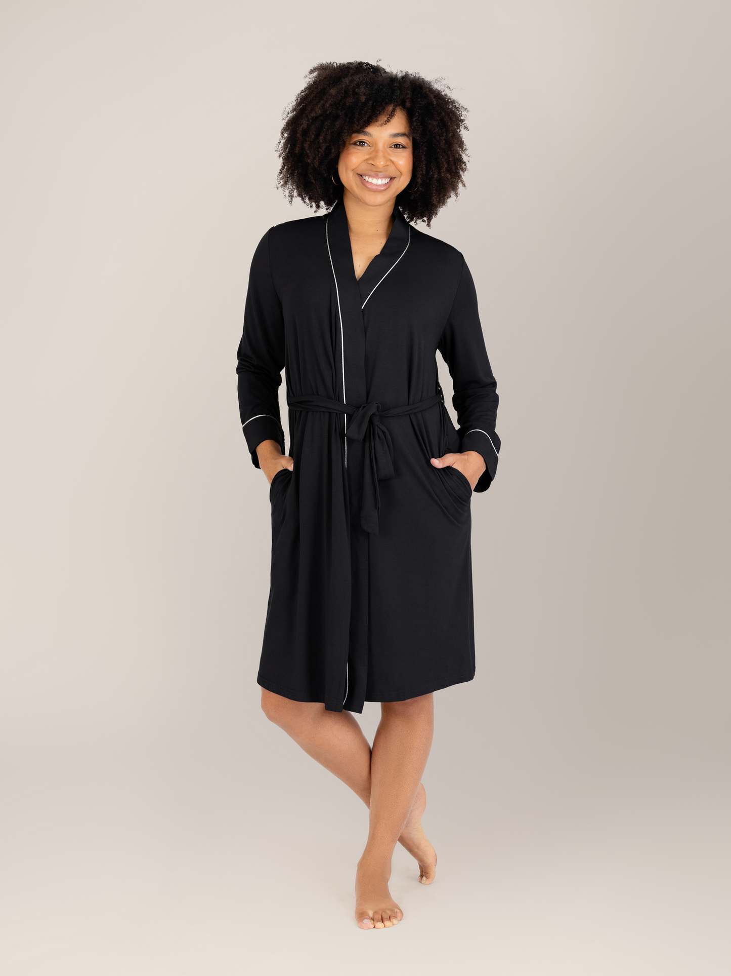 Model wearing the Clea Bamboo Robe in Black with her hands in the pockets. @model_info:Tess is 5'5" and wearing S/M.