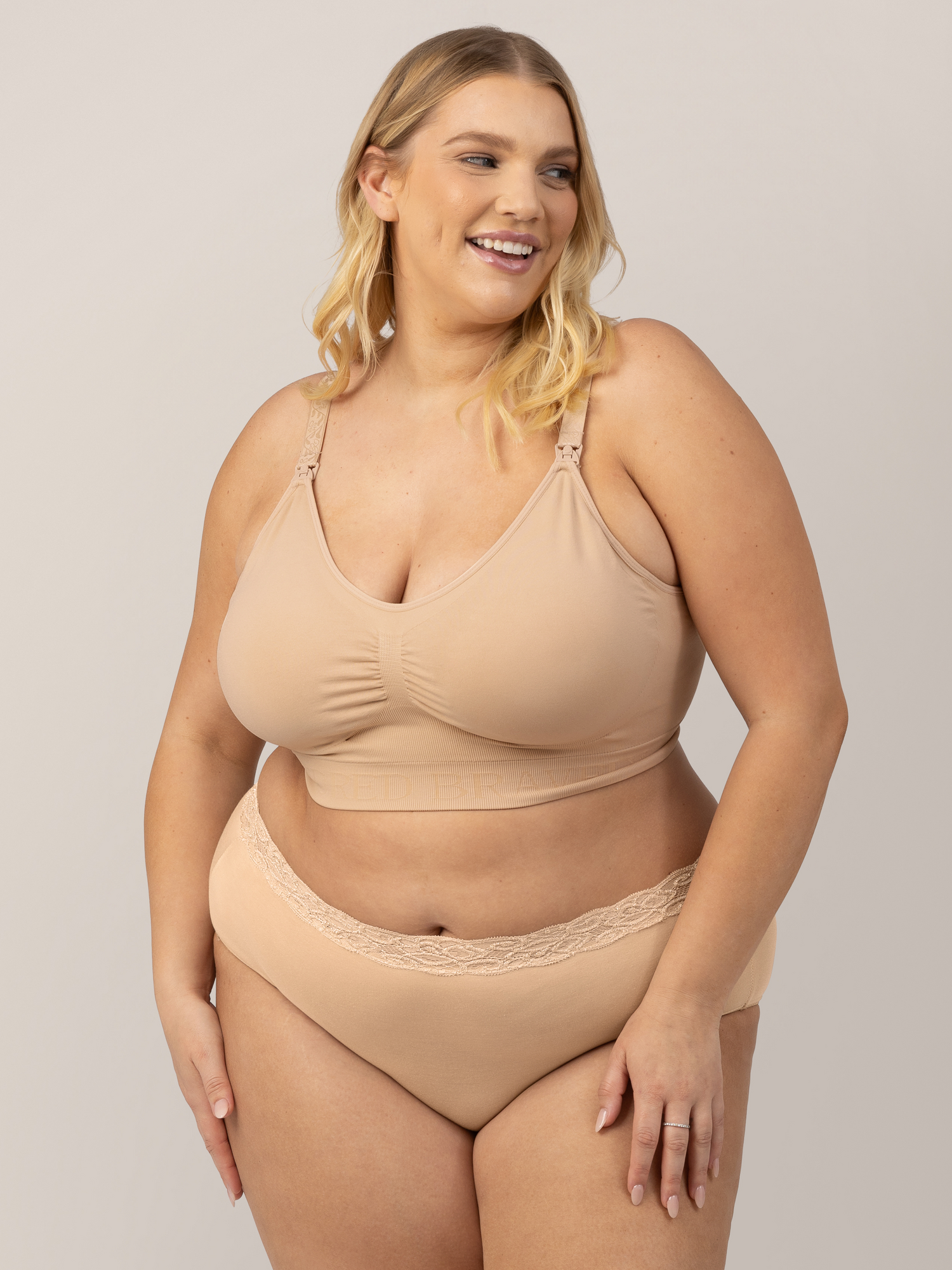 Model wearing the Simply Sublime® Nursing Bra in Beige with her hands on her legs. @model_info:Lauren is wearing a 1X Busty.