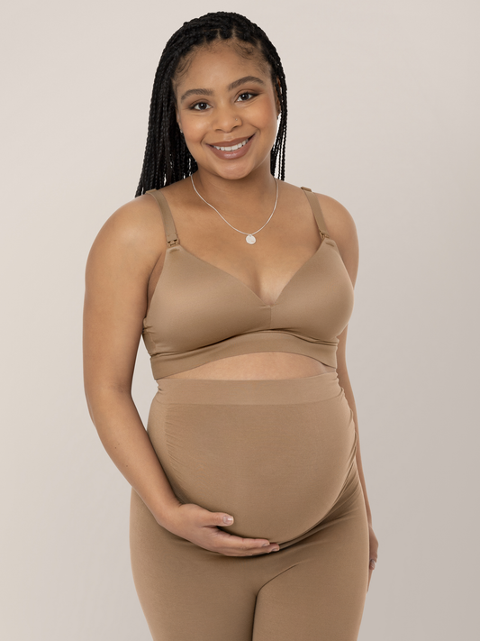 Front of a model wearing the Minimalist Hands-Free Pumping and Nursing Bra in Latte.@model_info:Ruby is wearing a Medium.