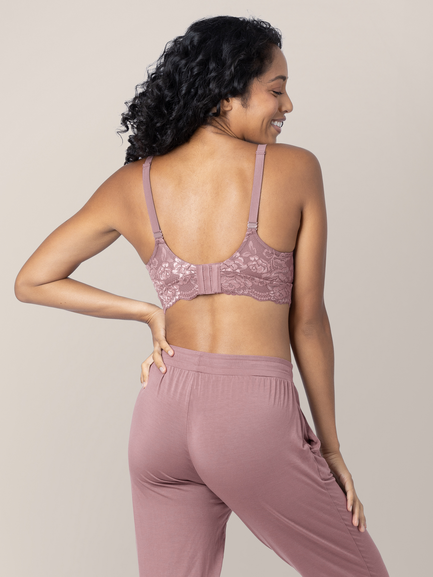 Back of a model wearing the Lace Minimalist Hands-Free Pumping & Nursing Bra in Twilight