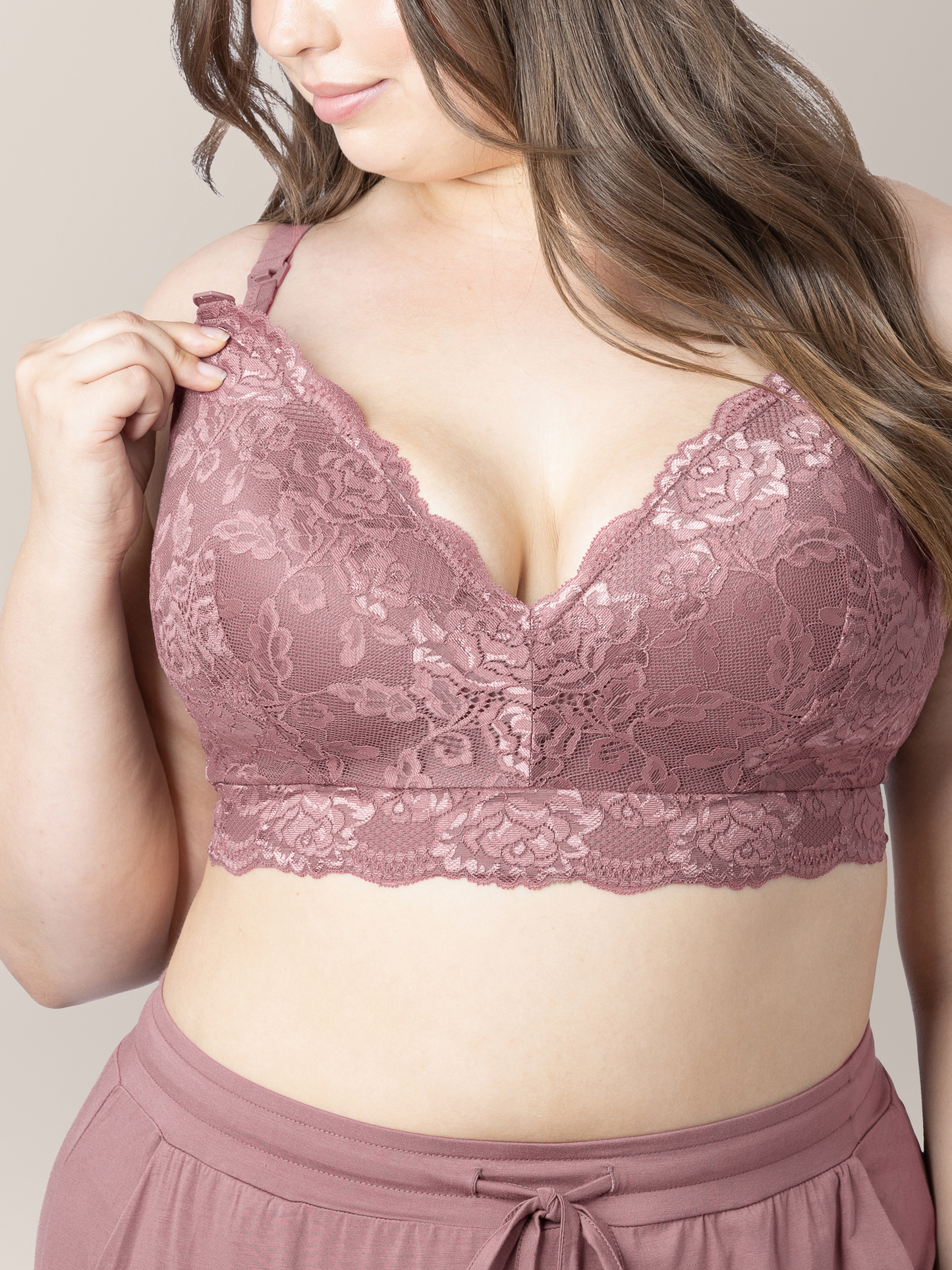 Model wearing the Lace Minimalist Nursing & Maternity Bra in Twilight looking at the easy clip down nursing access. 