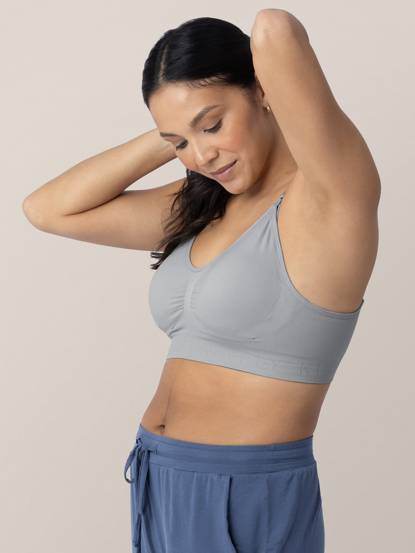 Model wearing the Simply Sublime® Nursing Bra in Grey with her hands in her hair.