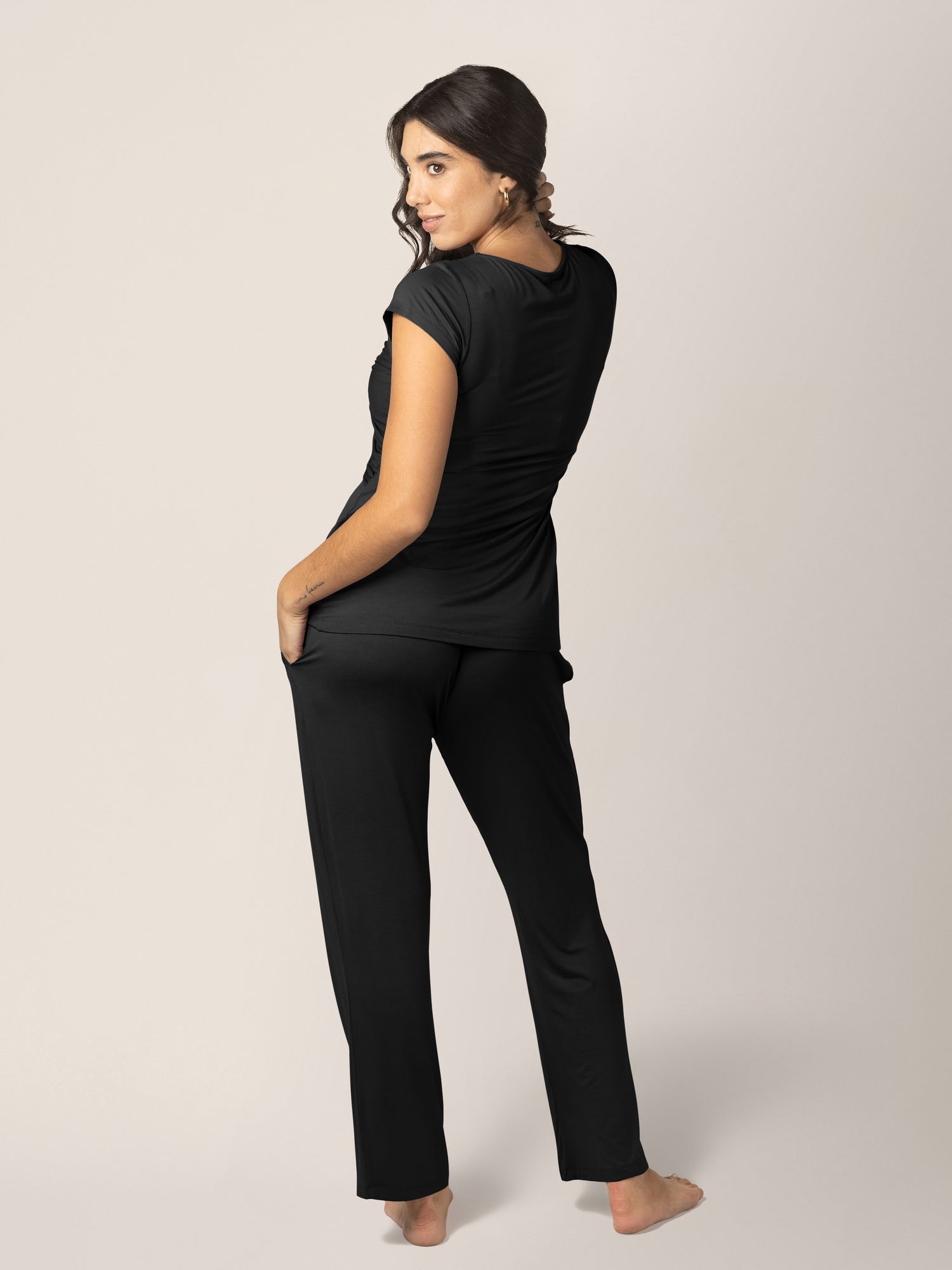 Back of a model wearing the Davy Maternity & Nursing Pajama Set in Black