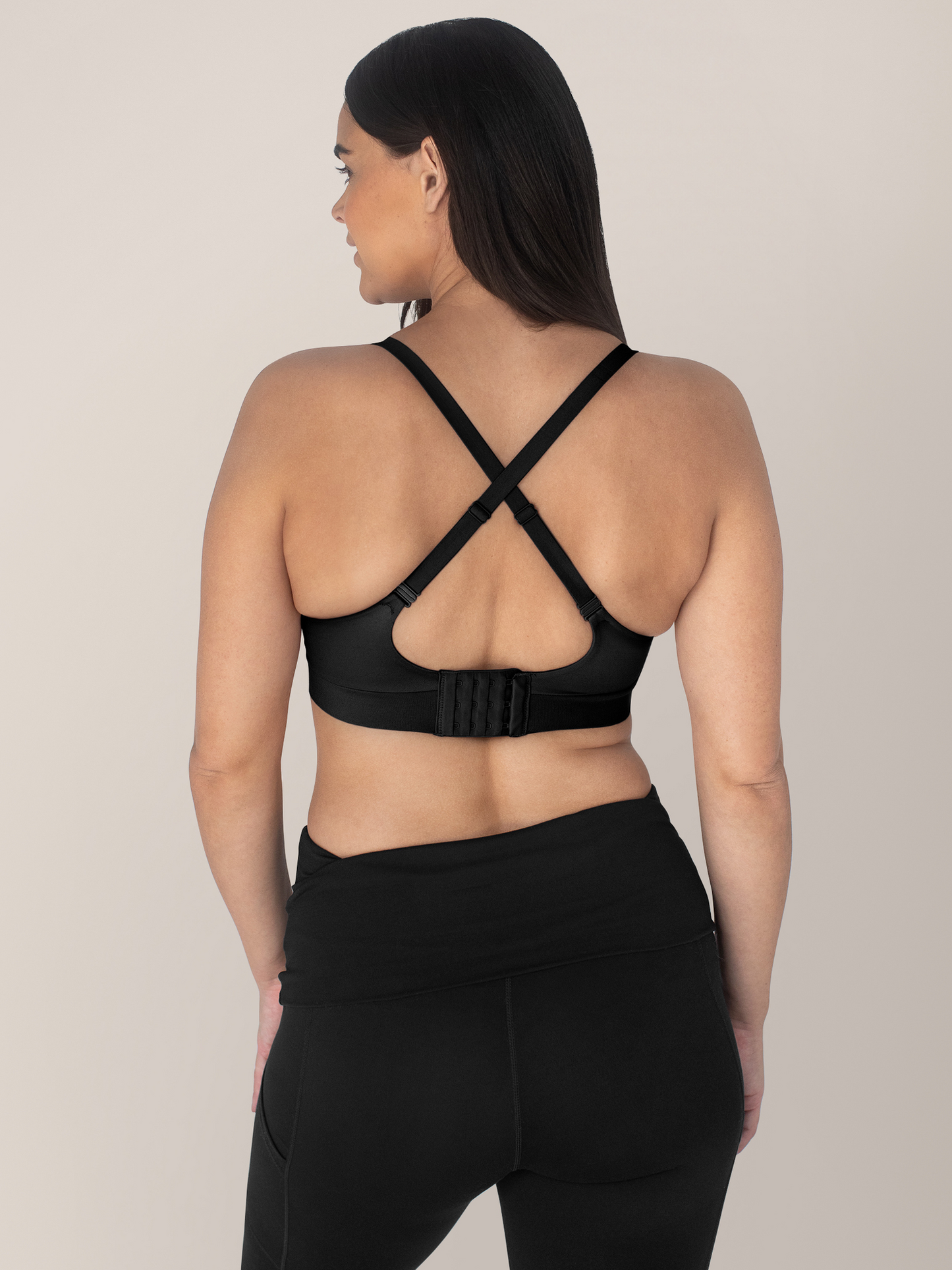 Back of a model wearing the Minimalist Hands-Free Pumping & Nursing Bra in Black. @model_info:Brooklyn is wearing a Small.