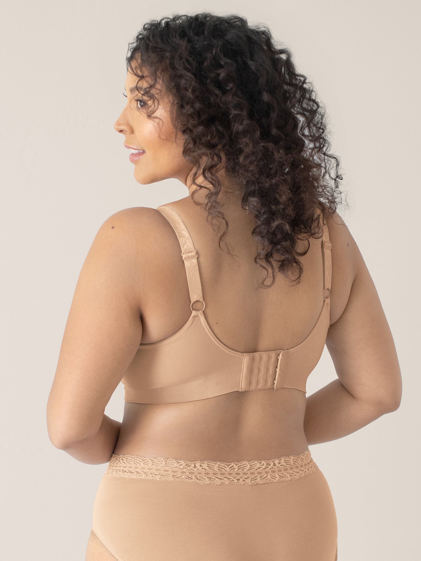 Back view of a model wearing the Nellie Sublime® Wireless Bra in Beige