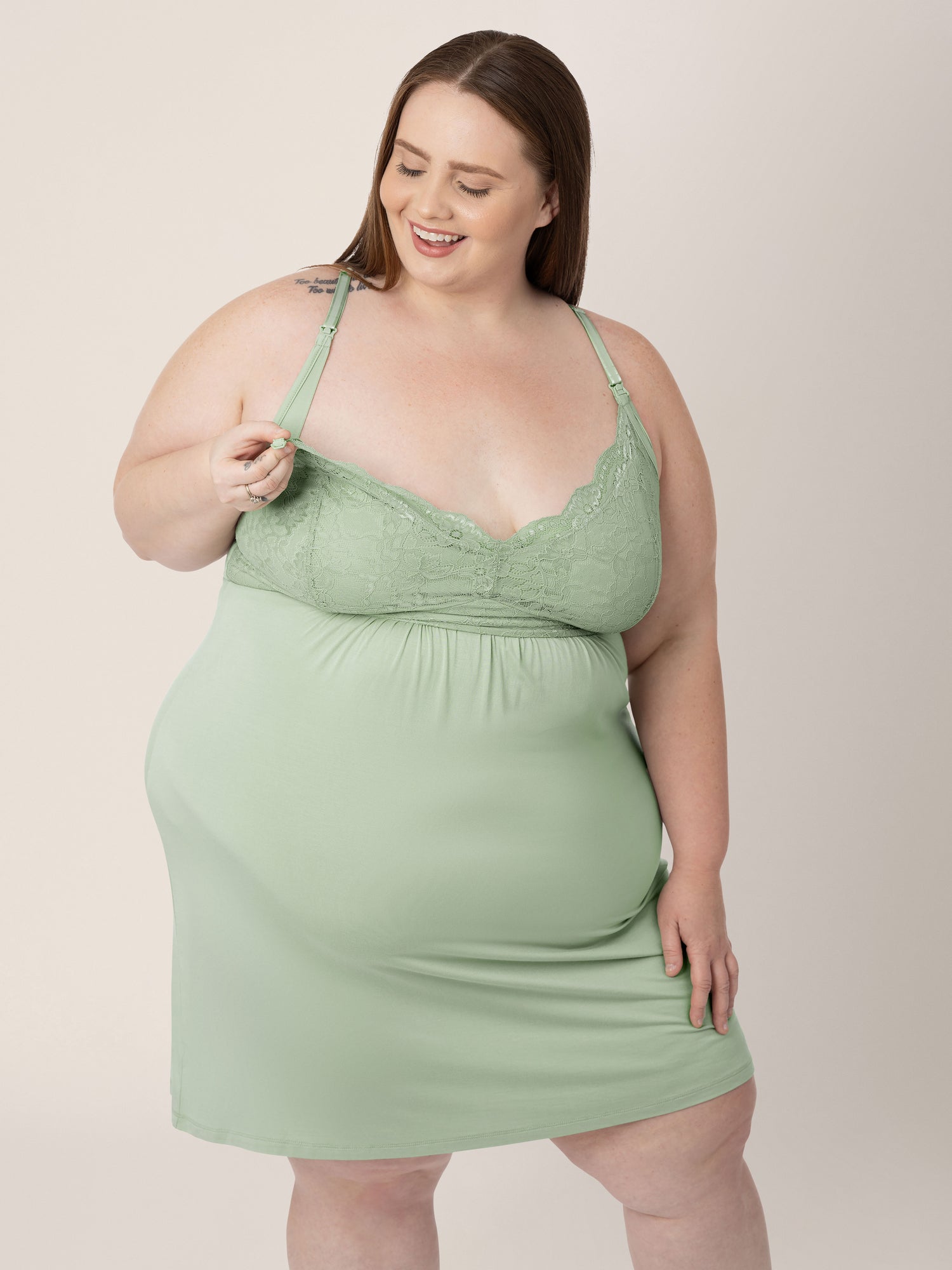 Model wearing the Lucille Maternity and Nursing Nightgown in Pistachio showing the easy clip down nursing access.