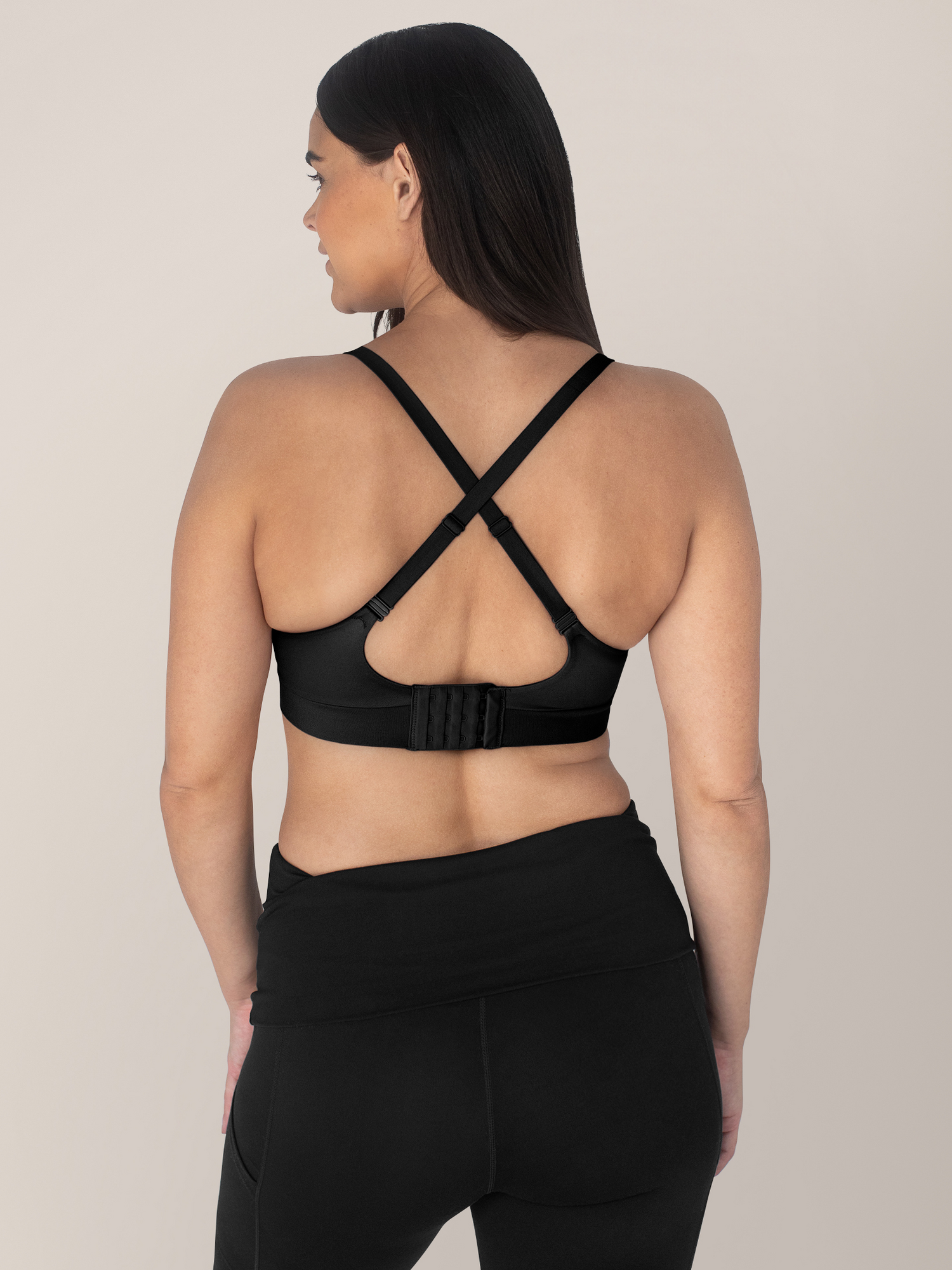 Back of a model wearing the Minimalist Maternity & Nursing Bra in Black.