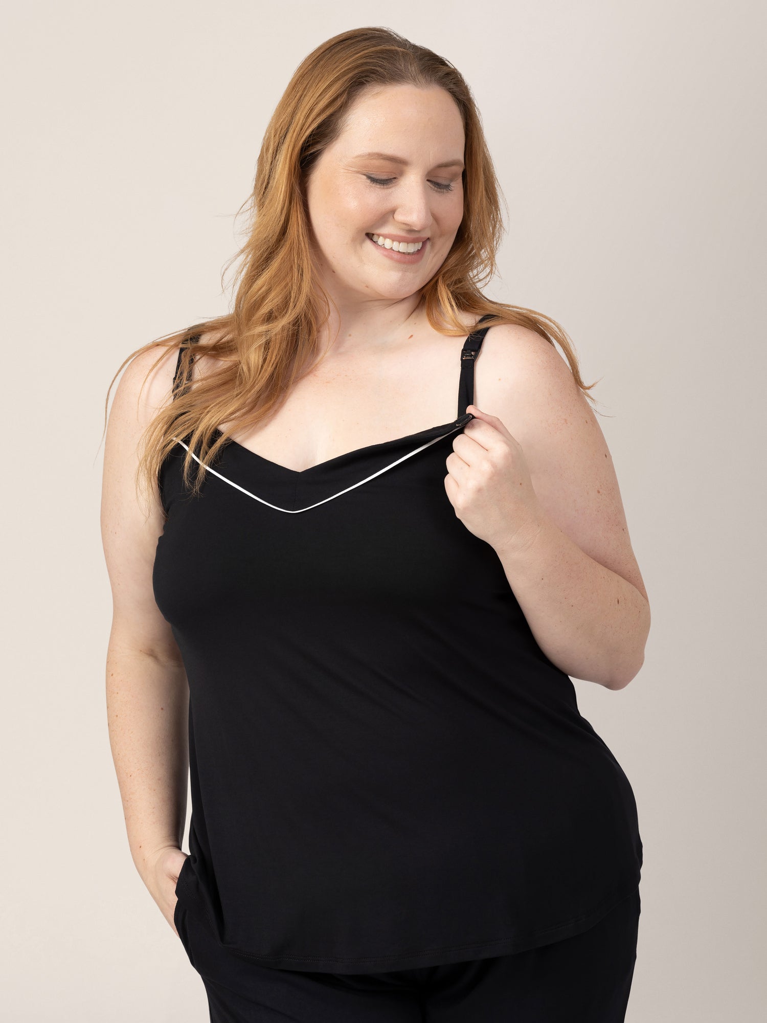 Closeup of a model wearing the Clea Bamboo Nursing Tank & Capri Pajama Set  in Black, showing the clipdown access