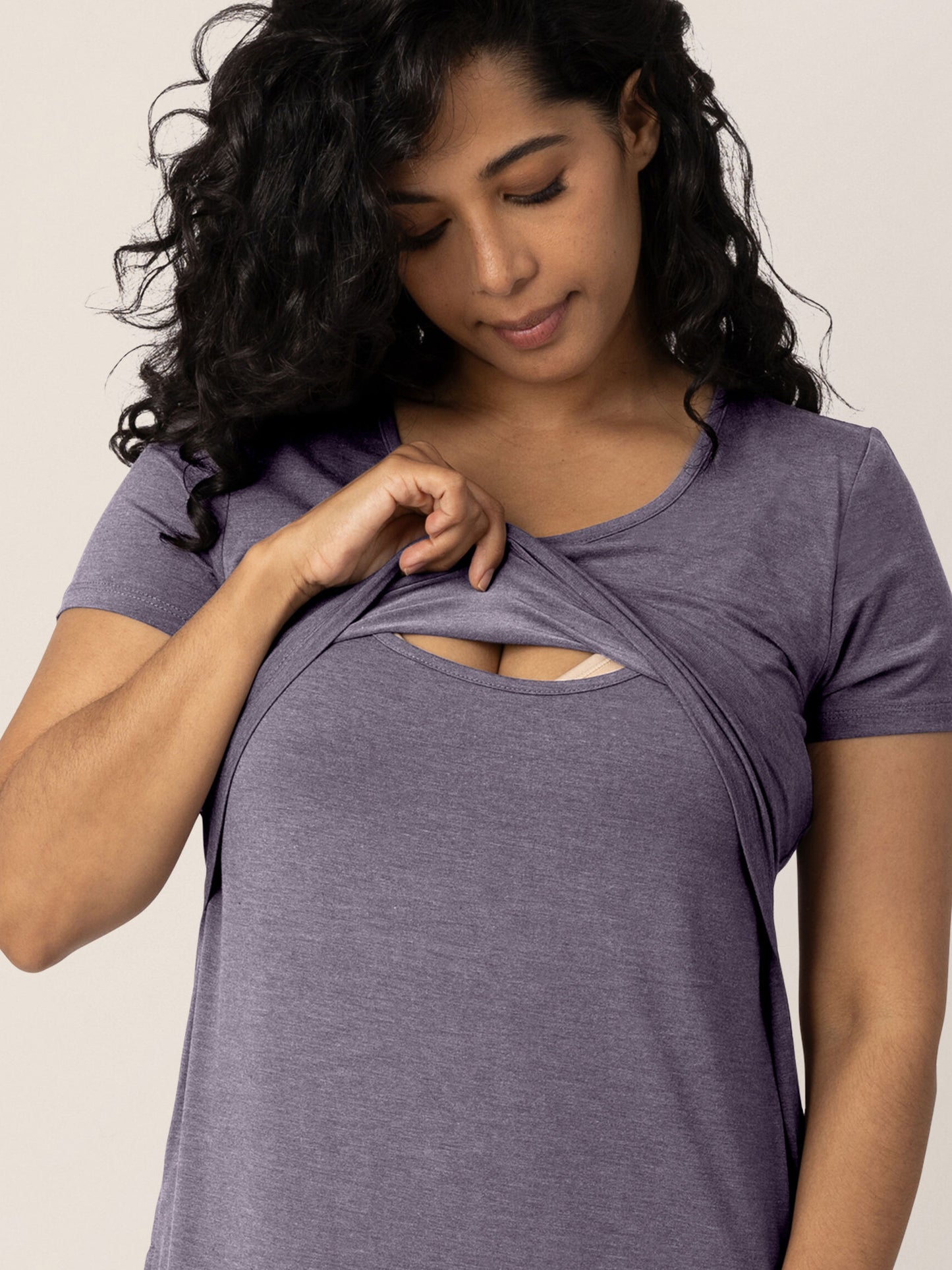 Model pulling up the convenient nursing panel on the Eleanora Bamboo Maternity & Nursing Dress in Heathered Granite