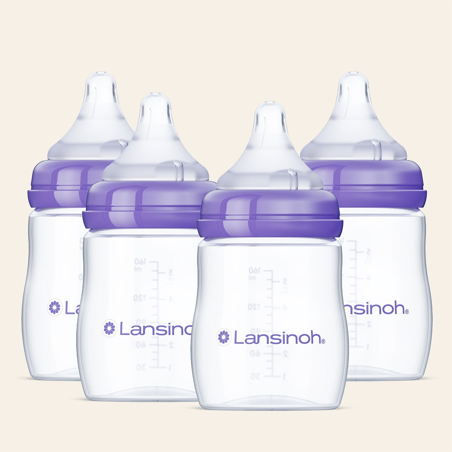 Four Lansinoh baby bottles with purple caps on a beige background