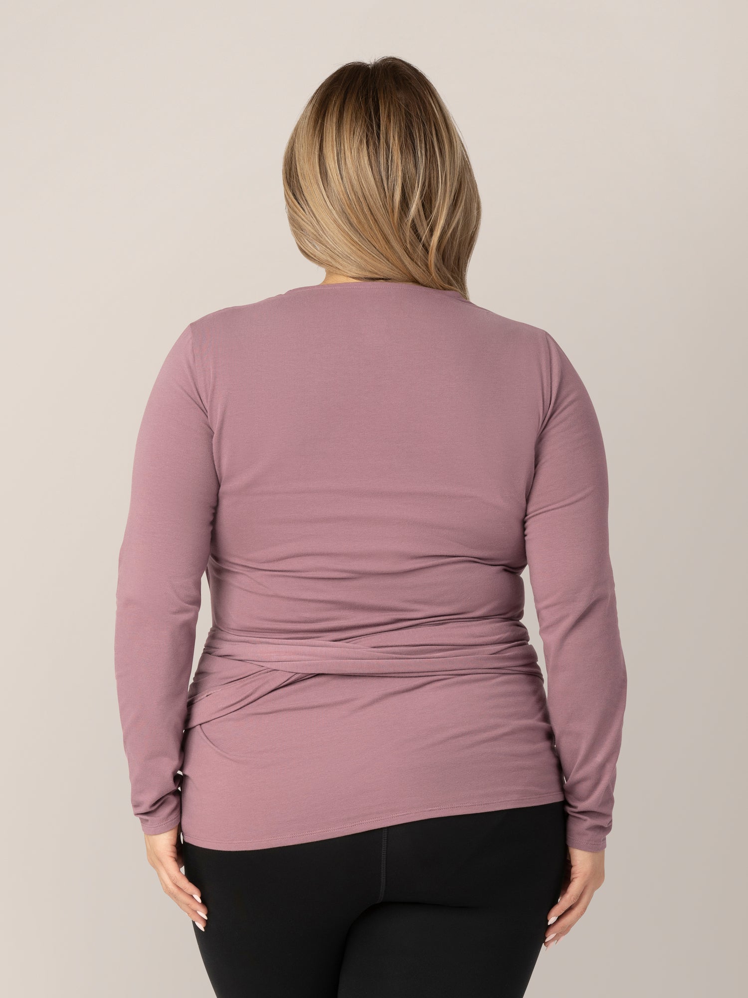 Back view of model wearing the Organic Cotton Skin to Skin Long Sleeve Wrap Top in Twilight.