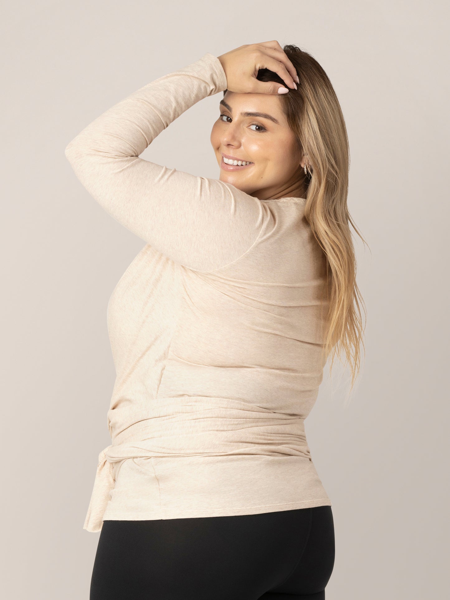 Side and back view of model wearing the Organic Cotton Skin to Skin Long Sleeve Wrap Top in Oatmeal Heather.