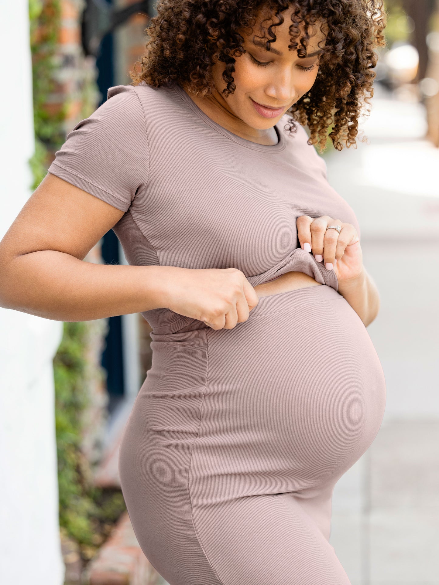 Pregnant model wearing the Ribbed Bamboo Maternity & Postpartum Midi Skirt in lilac stone, paired with the crop top from the Olivia 2-in-1 Dress @model_info:Alysha is 5'6" and wearing a Large.