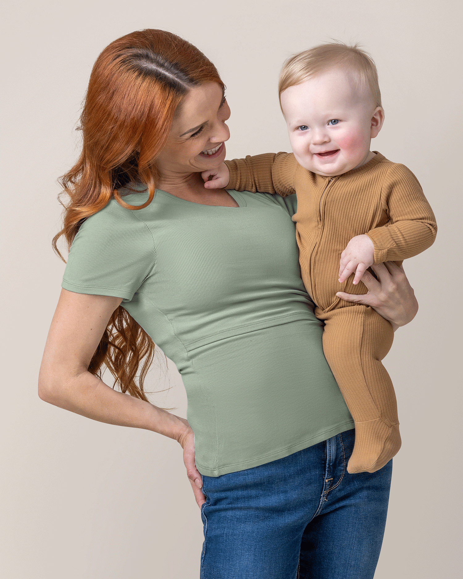 Front view of model wearing Ribbed Bamboo Crew Neck Nursing T-shirt in Aqua Mist, holding baby  @model_info:Shannon is wearing a Small