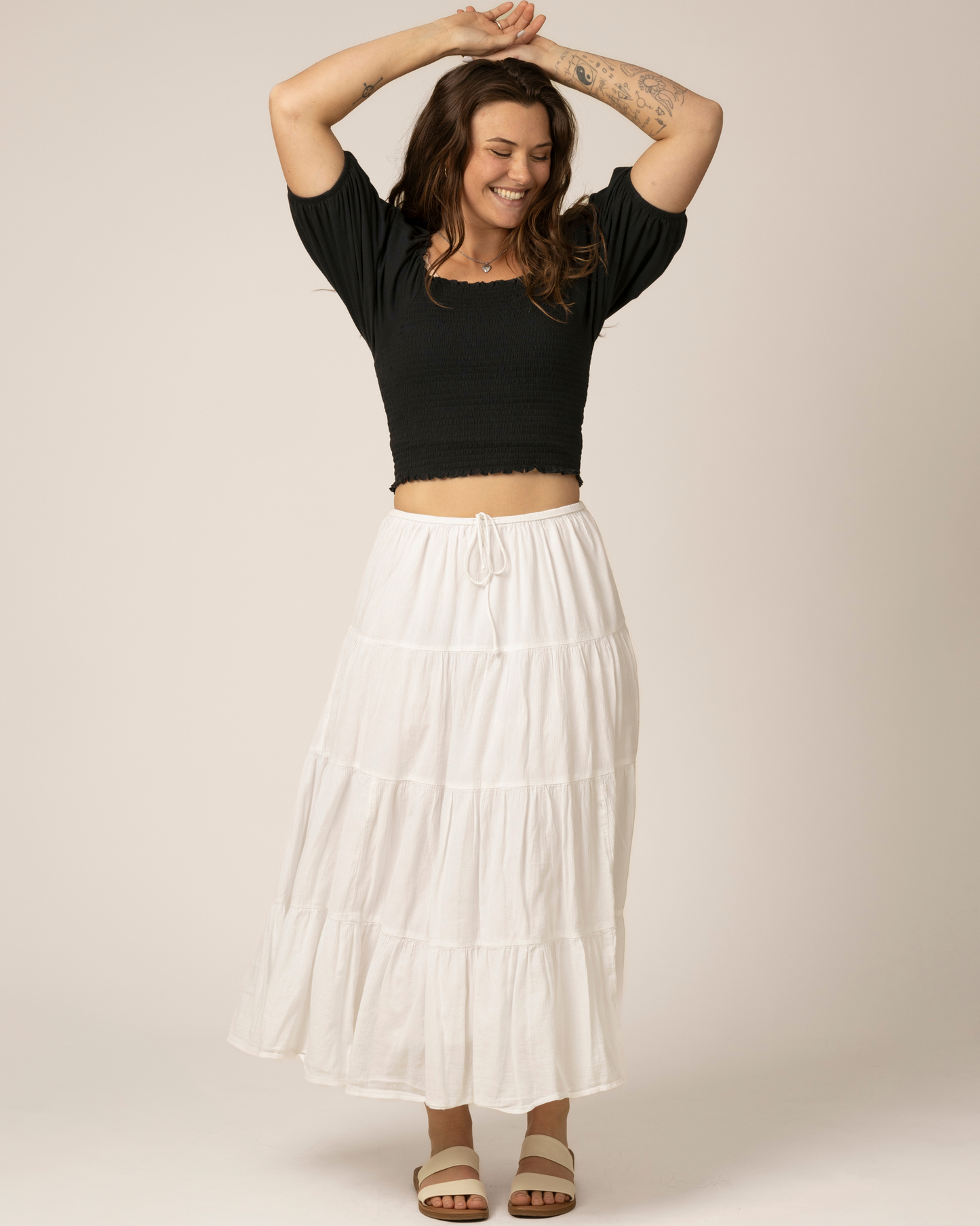 Front view of model wearing Sophia Smocked Cropped Nursing Top in Black