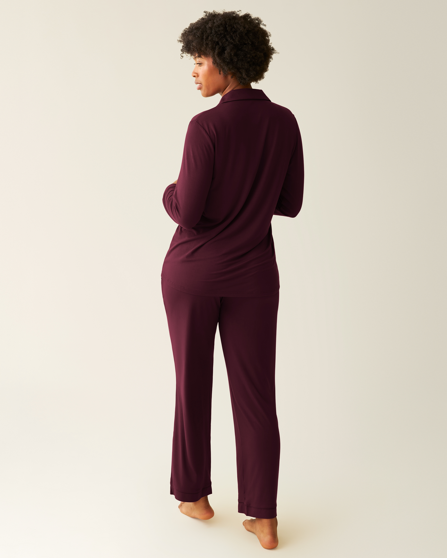 Back of woman wearing the Clea Bamboo Long Sleeve Pajama Set in Deep Burgundy