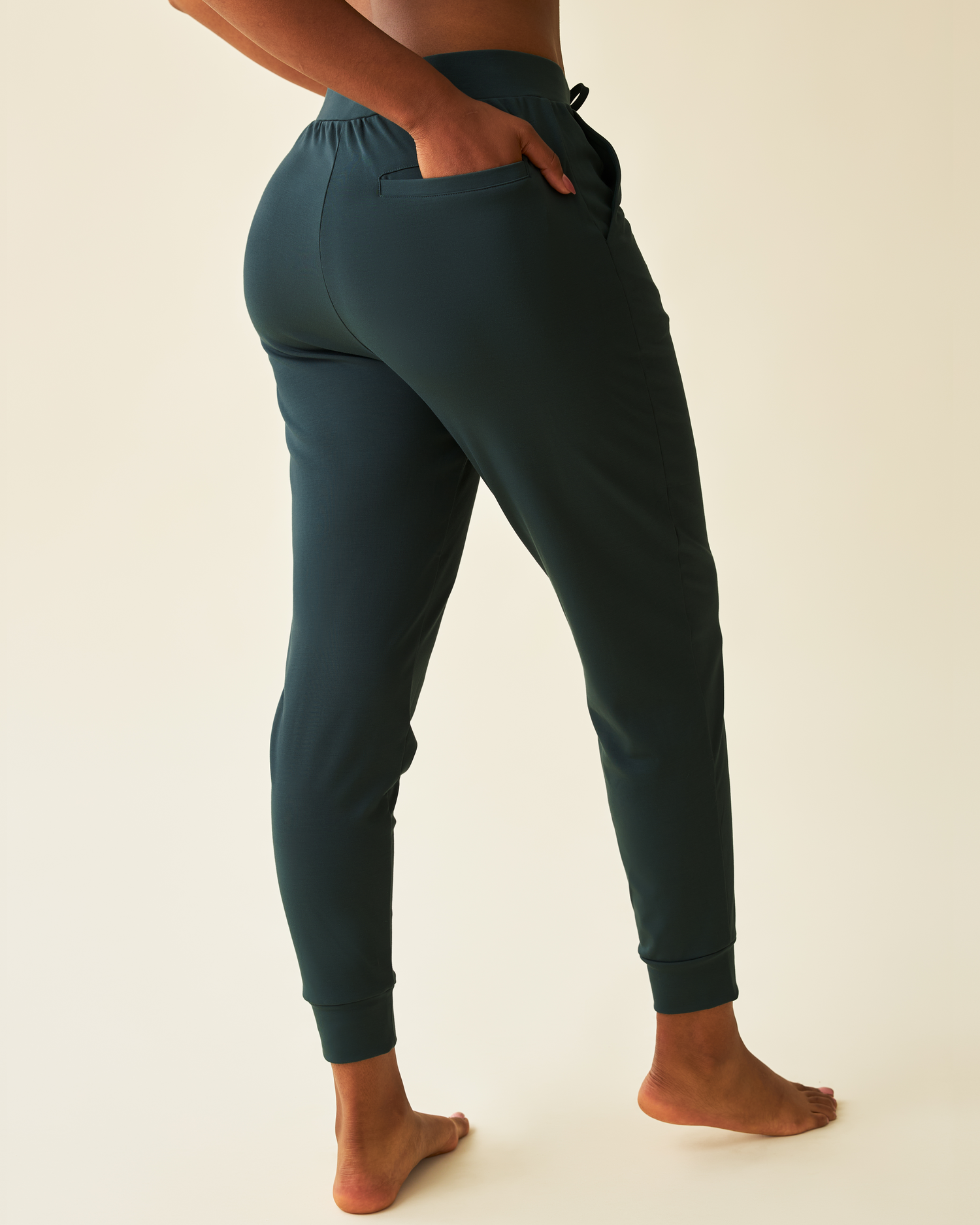 Back view of model wearing Brushed Bamboo Maternity & Postpartum Jogger in Evergreen