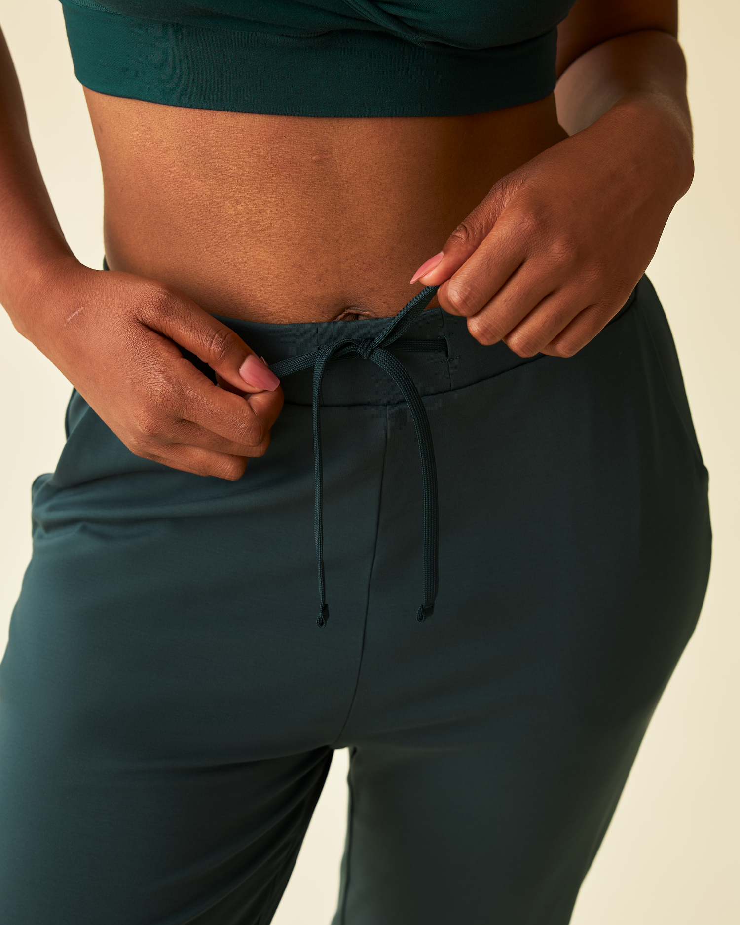 Close up of model wearing Brushed Bamboo Maternity & Postpartum Jogger in Evergreen
