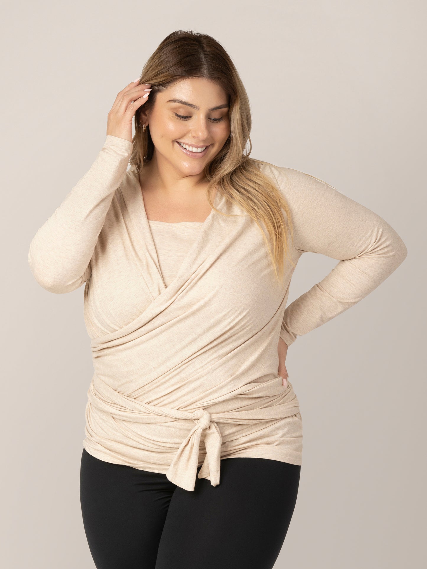 Front view of model wearing the Organic Cotton Skin to Skin Long Sleeve Wrap Top in Oatmeal Heather.