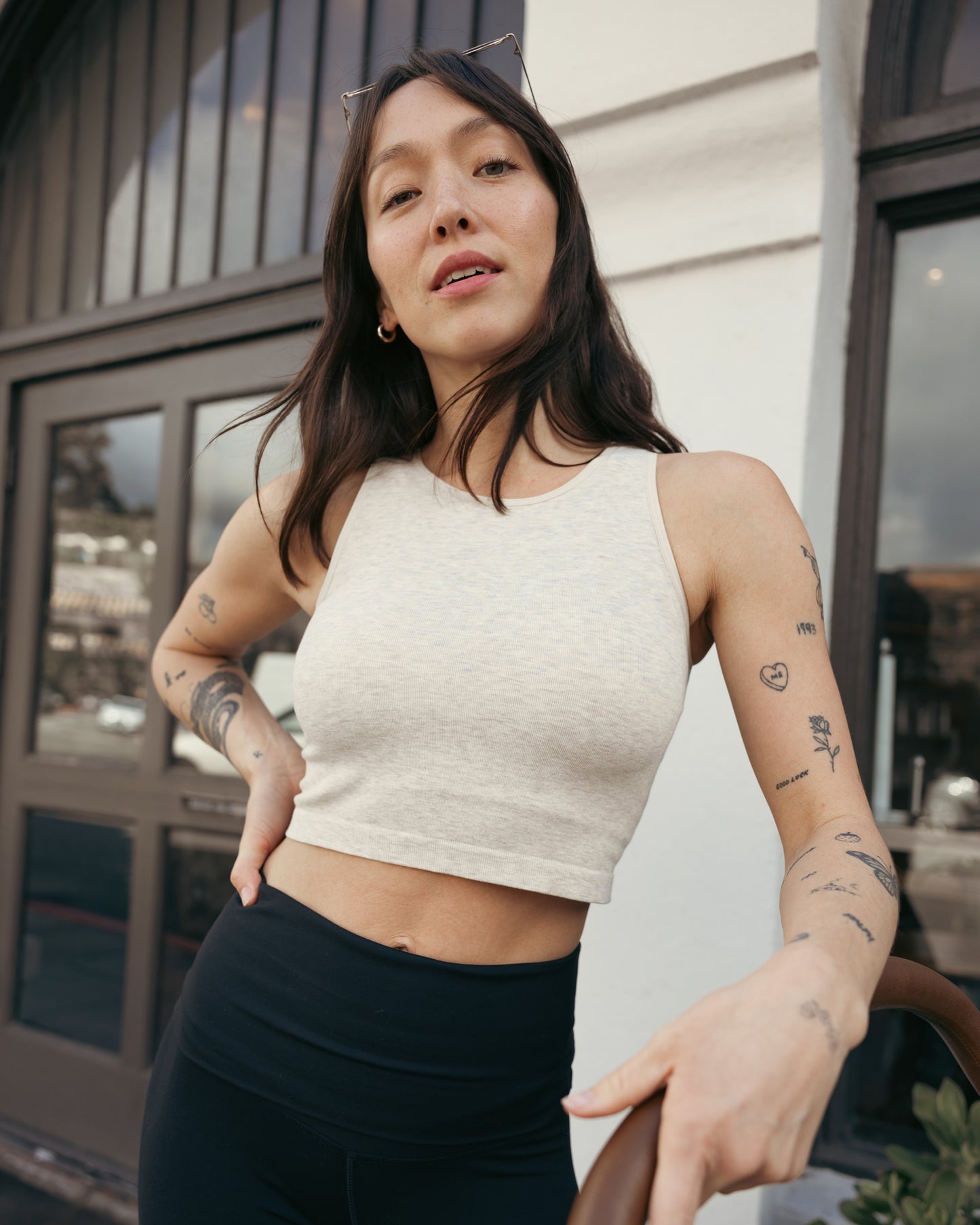 Front view of model outside wearing the Sublime Bamboo Maternity & Nursing Longline Bra in Oatmeal Heather, with hand on stroller.@model_info:Lyn is wearing a Small.