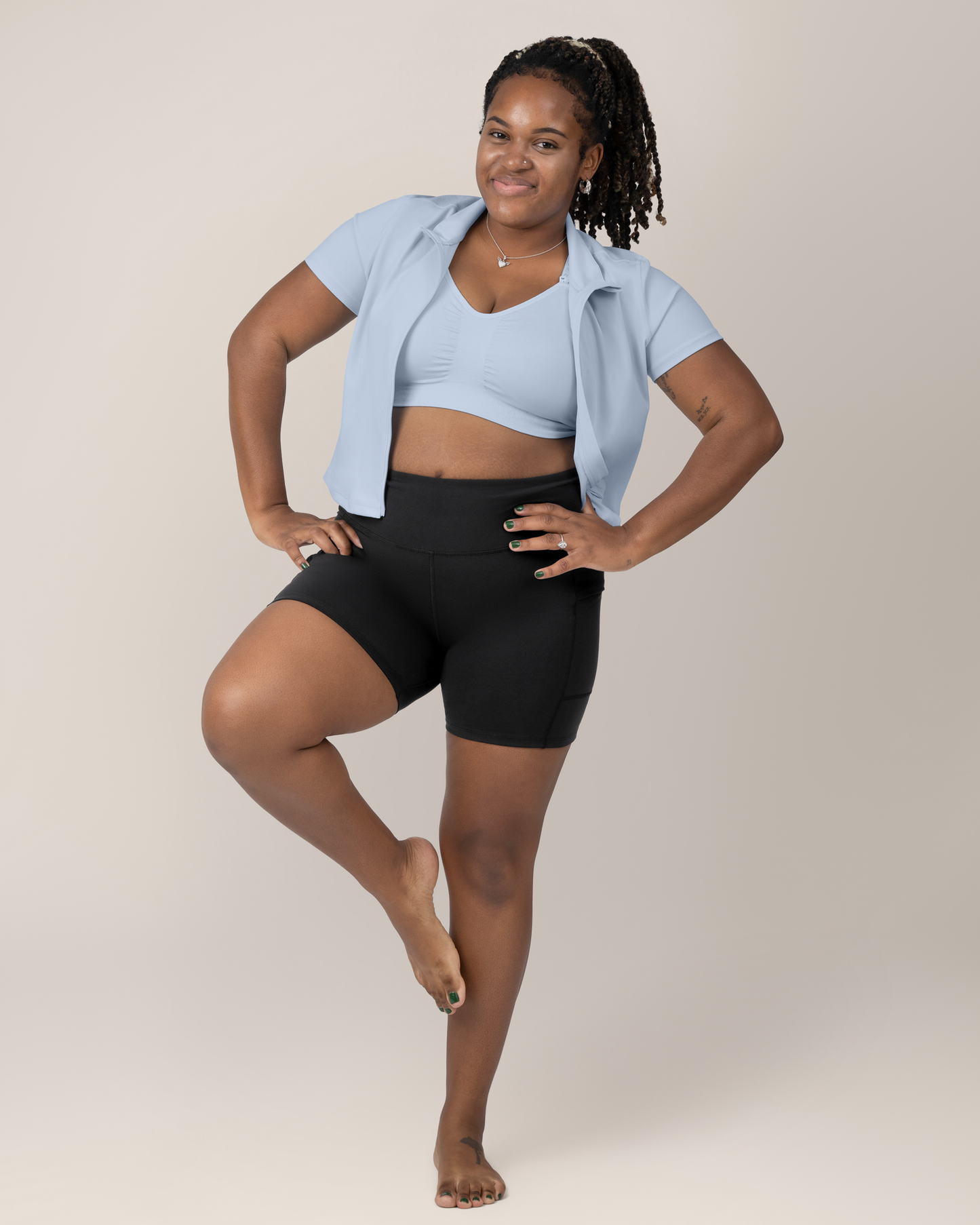 Front view of Model wearing the Presley Active Zip Front Nursing Top in Light Blue