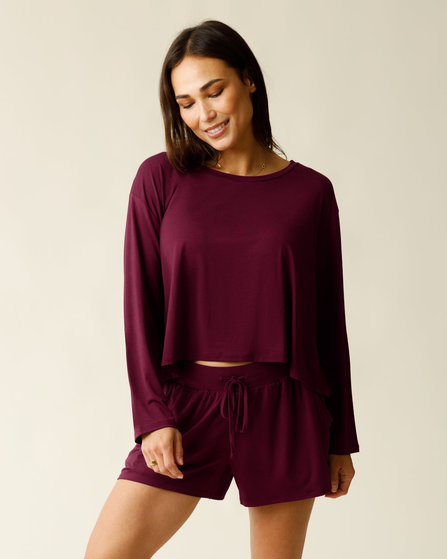Woman wearing the Aria Bamboo Casual Cropped Long Sleeve Top in Deep Burgundy, paired with matching Aria Bamboo Casual Lounge Short