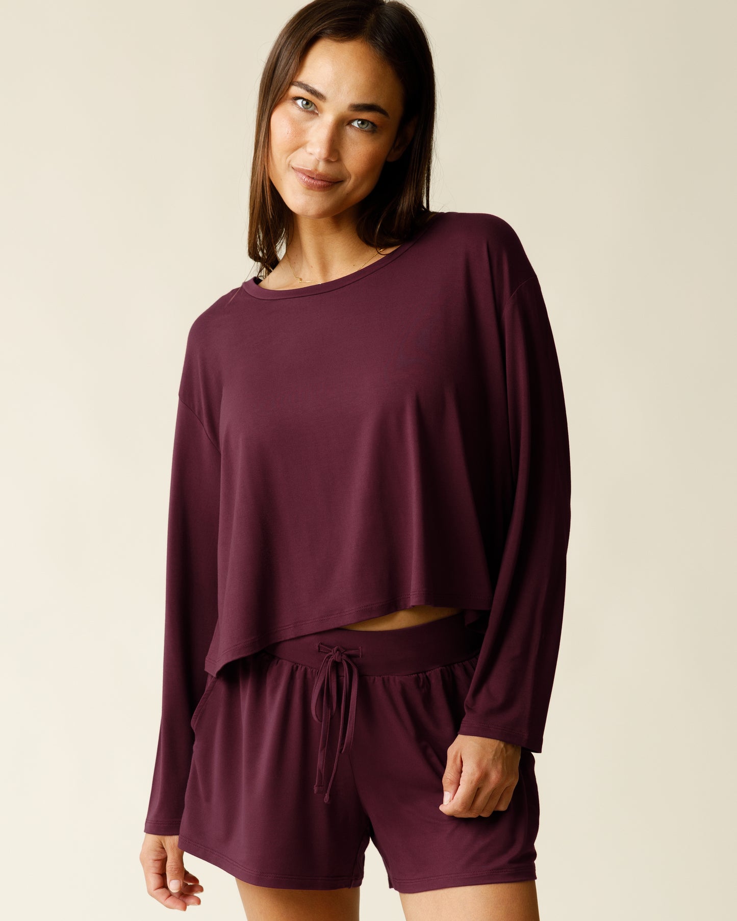 Woman wearing the Aria Bamboo Casual Cropped Long Sleeve Top in Deep Burgundy, paired with matching Aria Bamboo Casual Lounge Short@model_info:Lisa is wearing a Small.