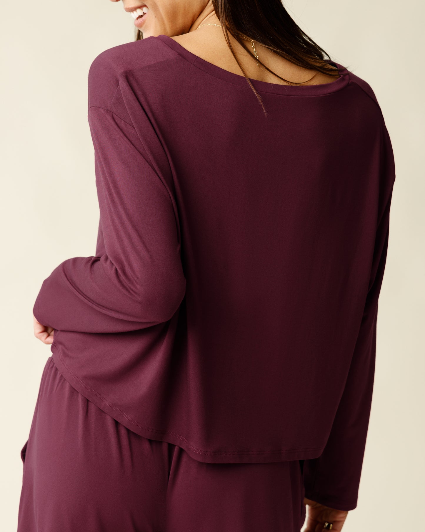 Woman wearing the Aria Bamboo Casual Cropped Long Sleeve Top in Deep Burgundy, showing the back
