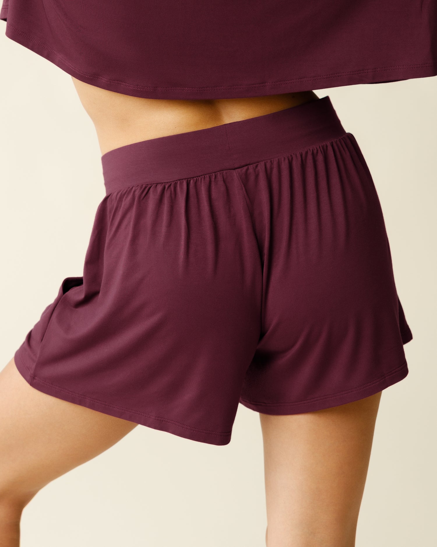 Woman wearing the Aria Bamboo Casual Lounge Short in Deep Burgundy, showing back view