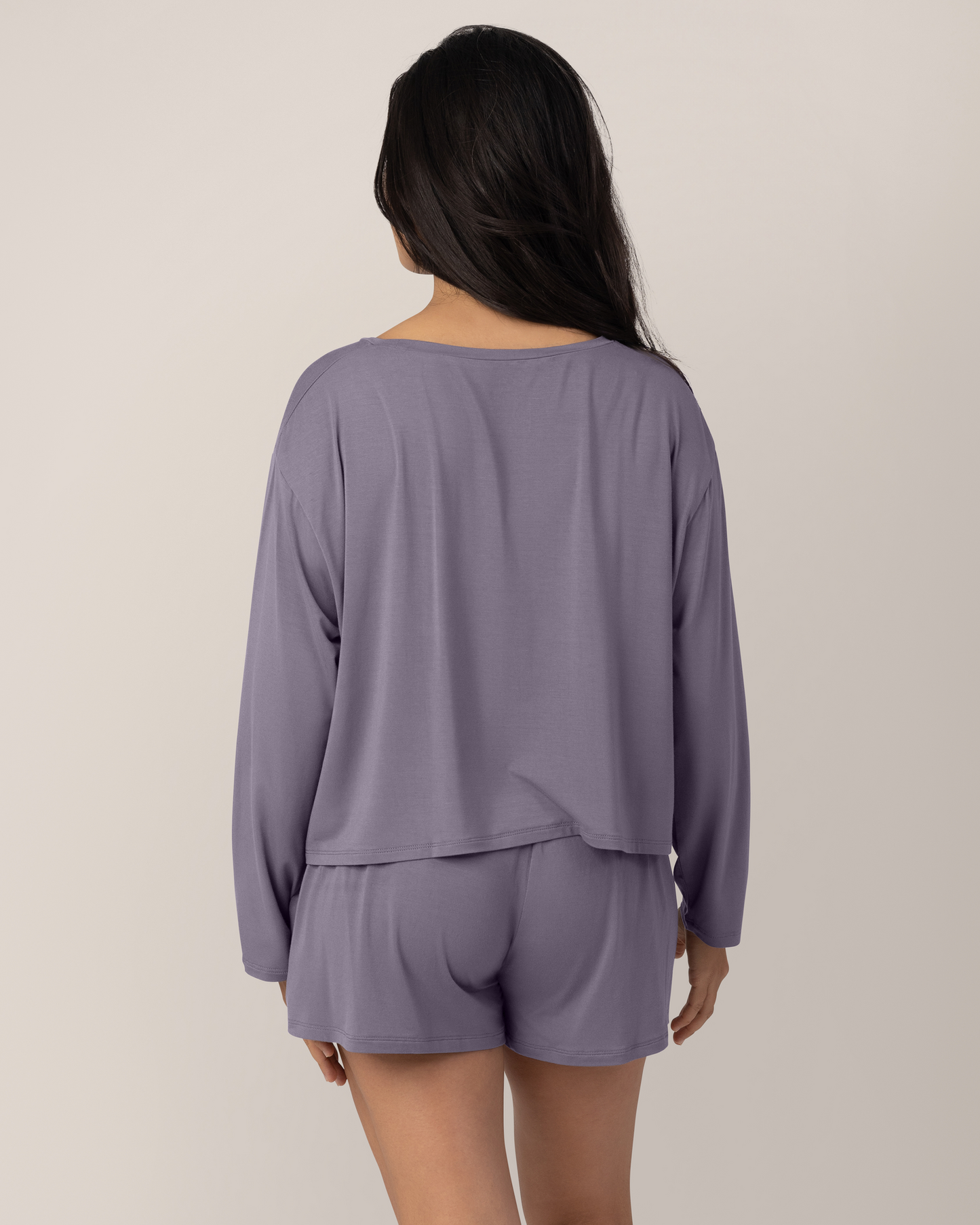 Back view of model wearing the Aria Bamboo Casual Lounge Short in Granite, paired with matching Aria Bamboo Casual Cropped Long Sleeve Top