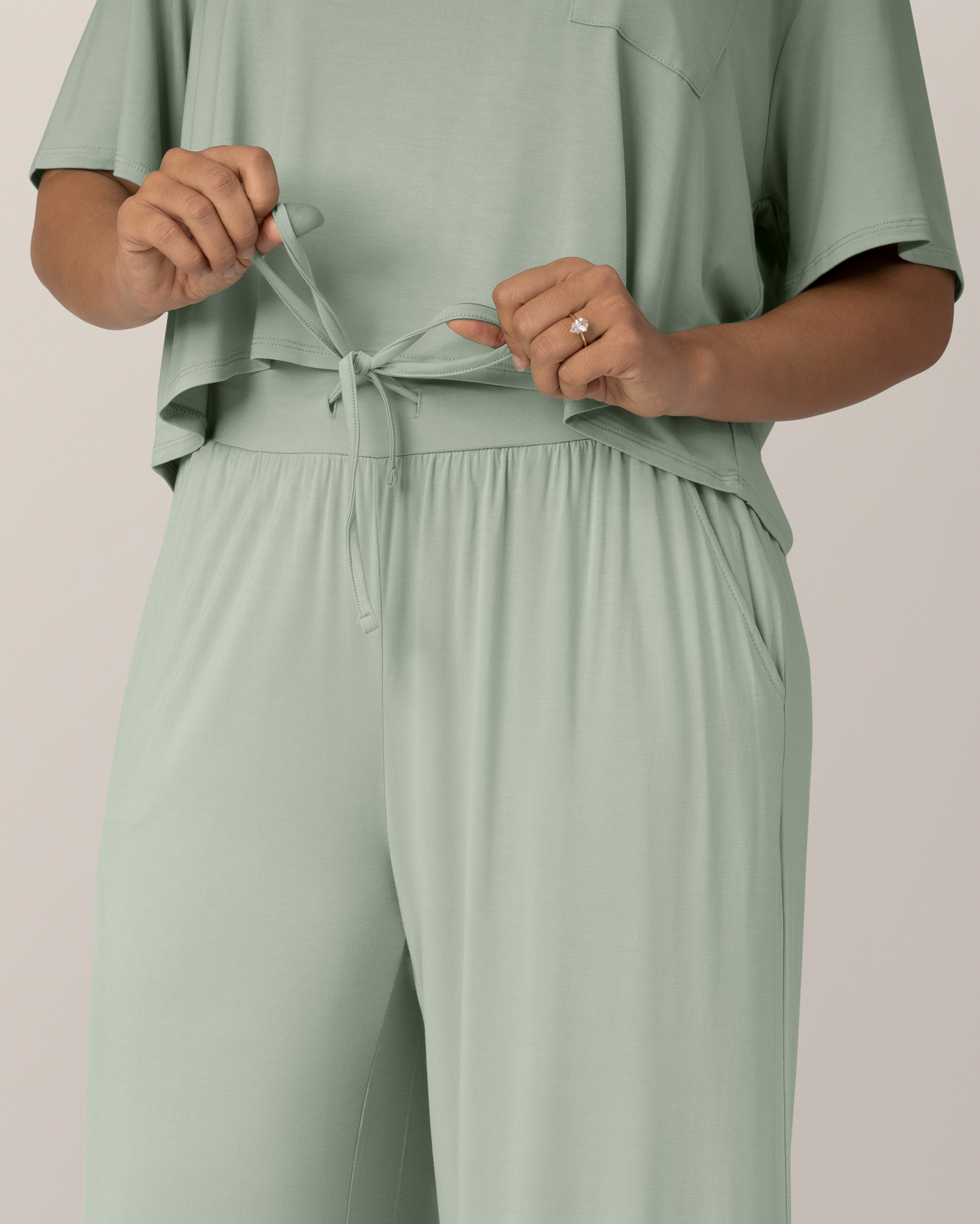 Close up of drawstring and waistband betail on the Aria Bamboo Casual Lounge Pant in Aqua Mist, on model