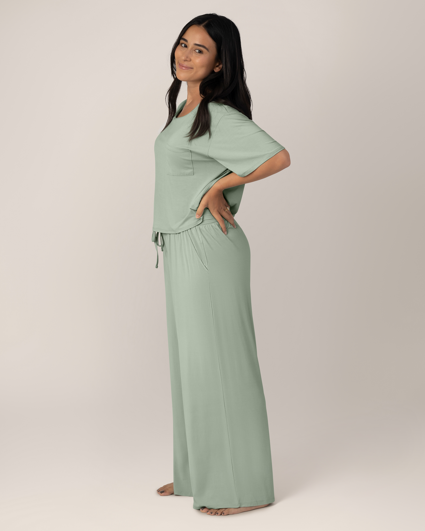Side view of model wearing the Aria Bamboo Casual Lounge Pant in Aqua Mist paired with matching Aria Bamboo Casual Cropped short Sleeve Top