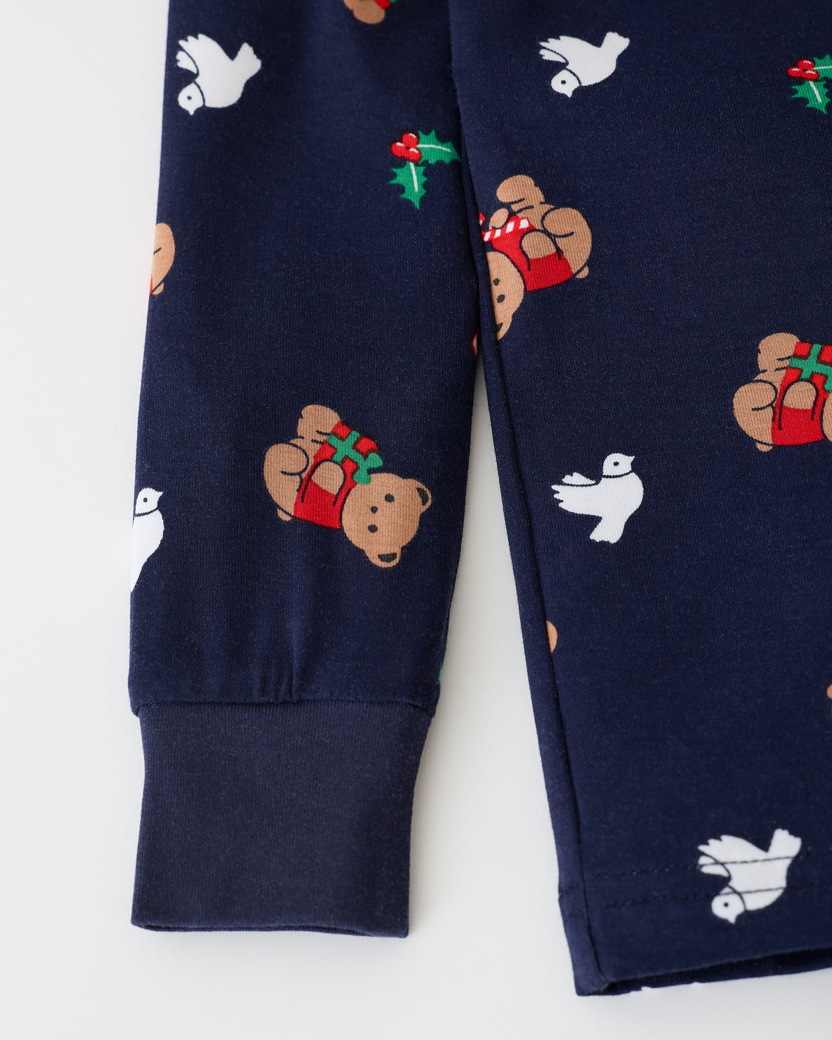 Close up of sleeve on the Bamboo Baby Two-Piece Pajama Set in Bearing Gifts on an off white background.