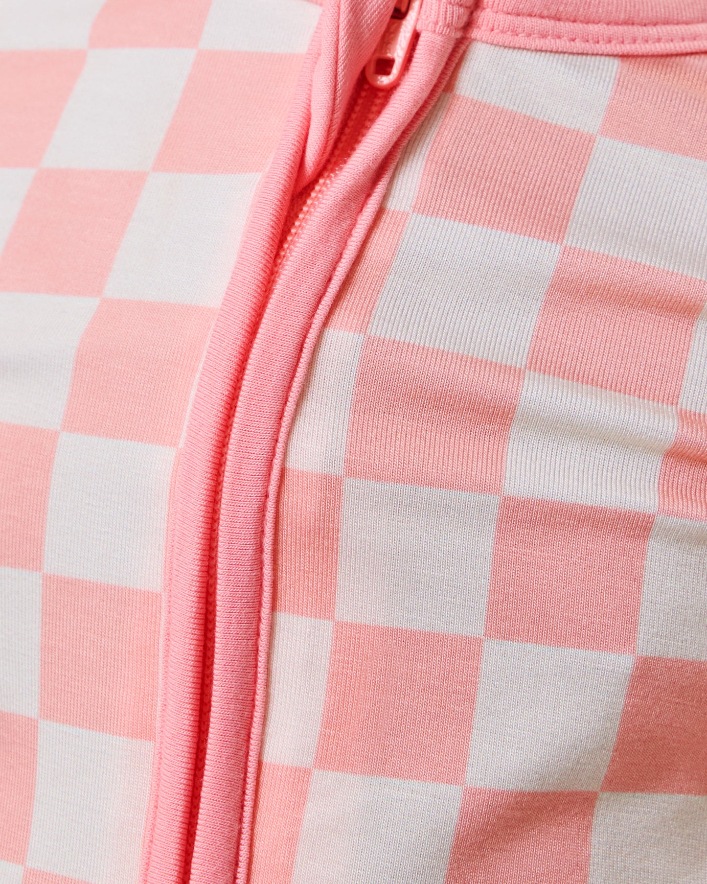 Closeup of baby wearing the Bamboo Baby Pajama in Pink Checker print