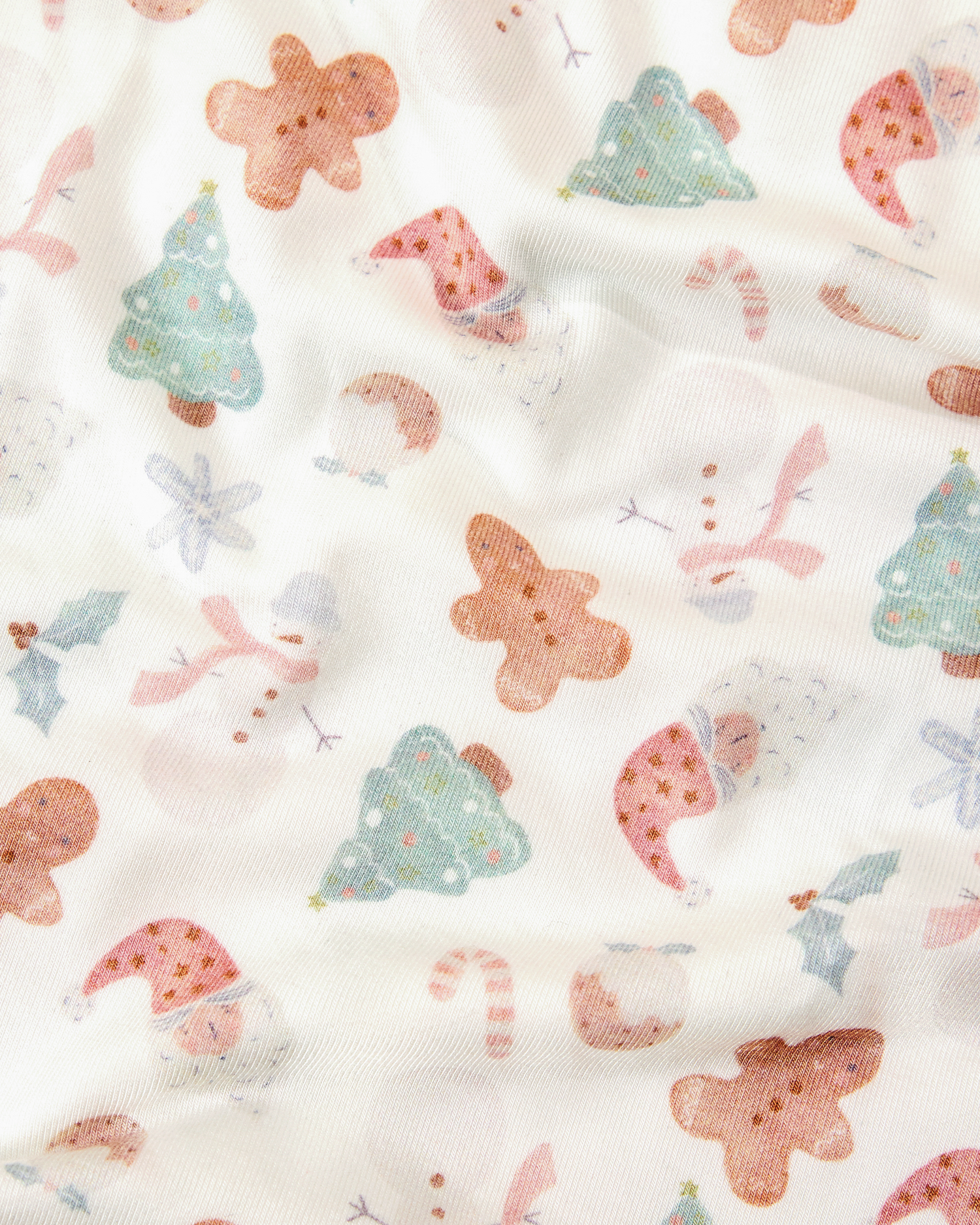The Bamboo Baby Pajama in Cozy Holiday - patterned fabric with gingerbread men, trees, and candy canes