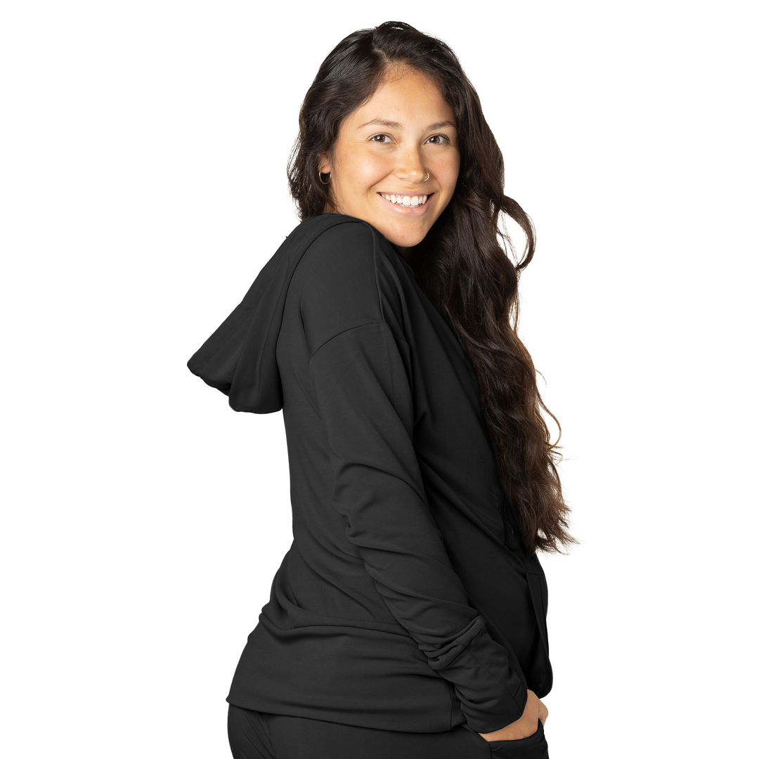 Side view of a pregnant model wearing the Bamboo Nursing Hoodie in Black