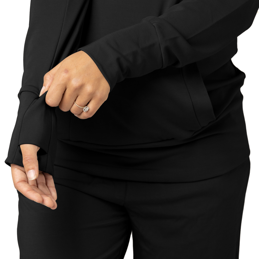 Close up of a model's sleeves while wearing the Bamboo Nursing Hoodie in Black