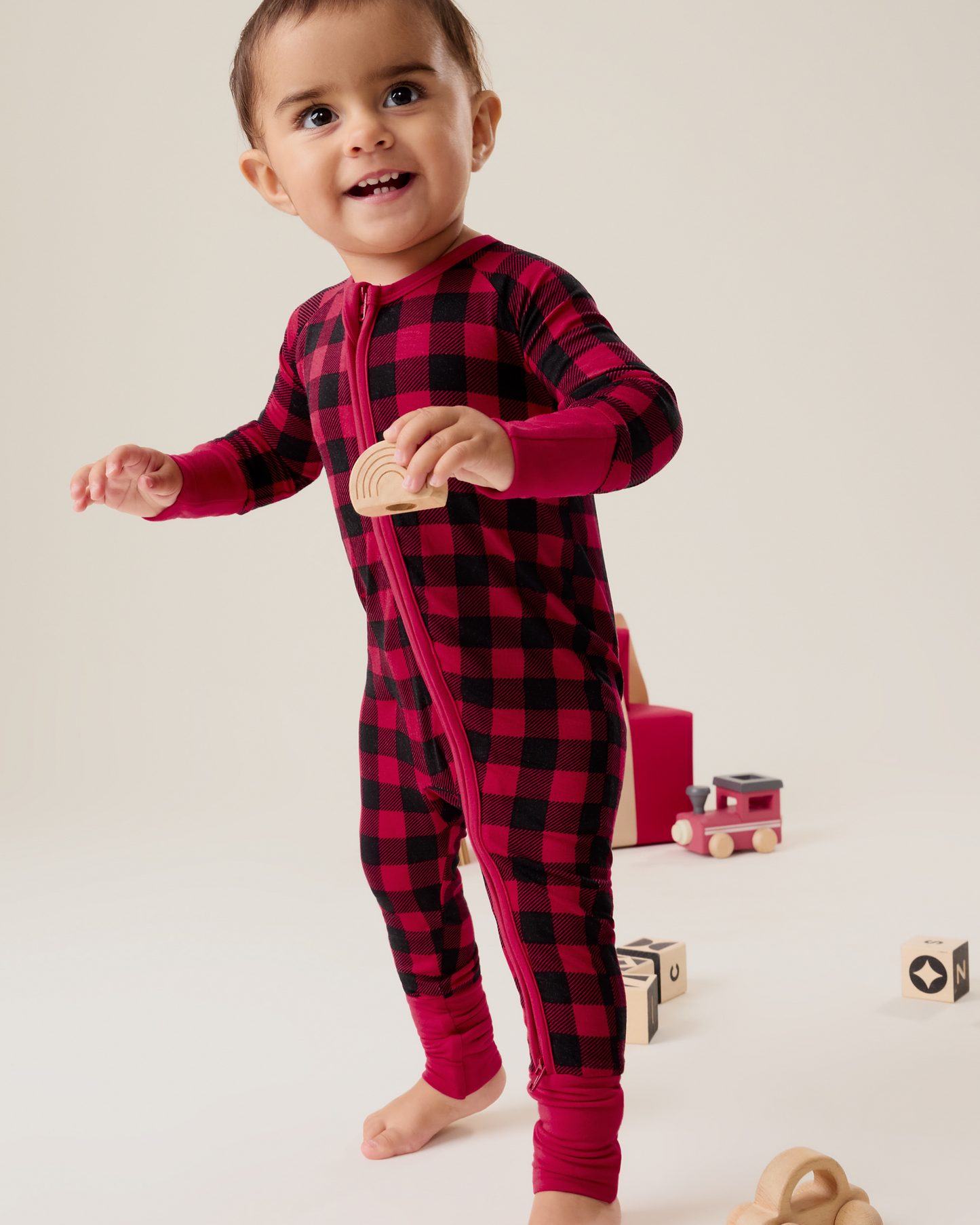 Baby wearing the Bamboo Baby Pajama in Red Plaid@model_info:Delilah is wearing 3-6 months.