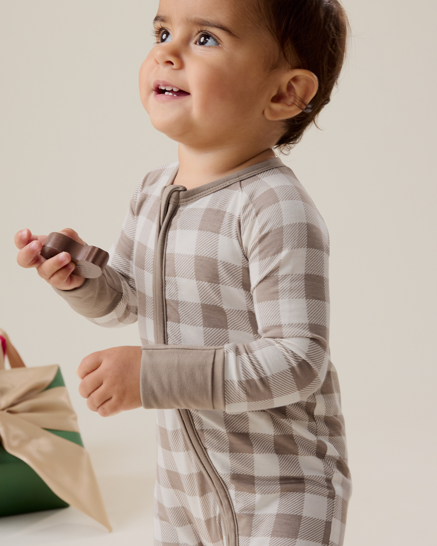 Baby wearing the Bamboo Baby Pajama in Taupe Gingham