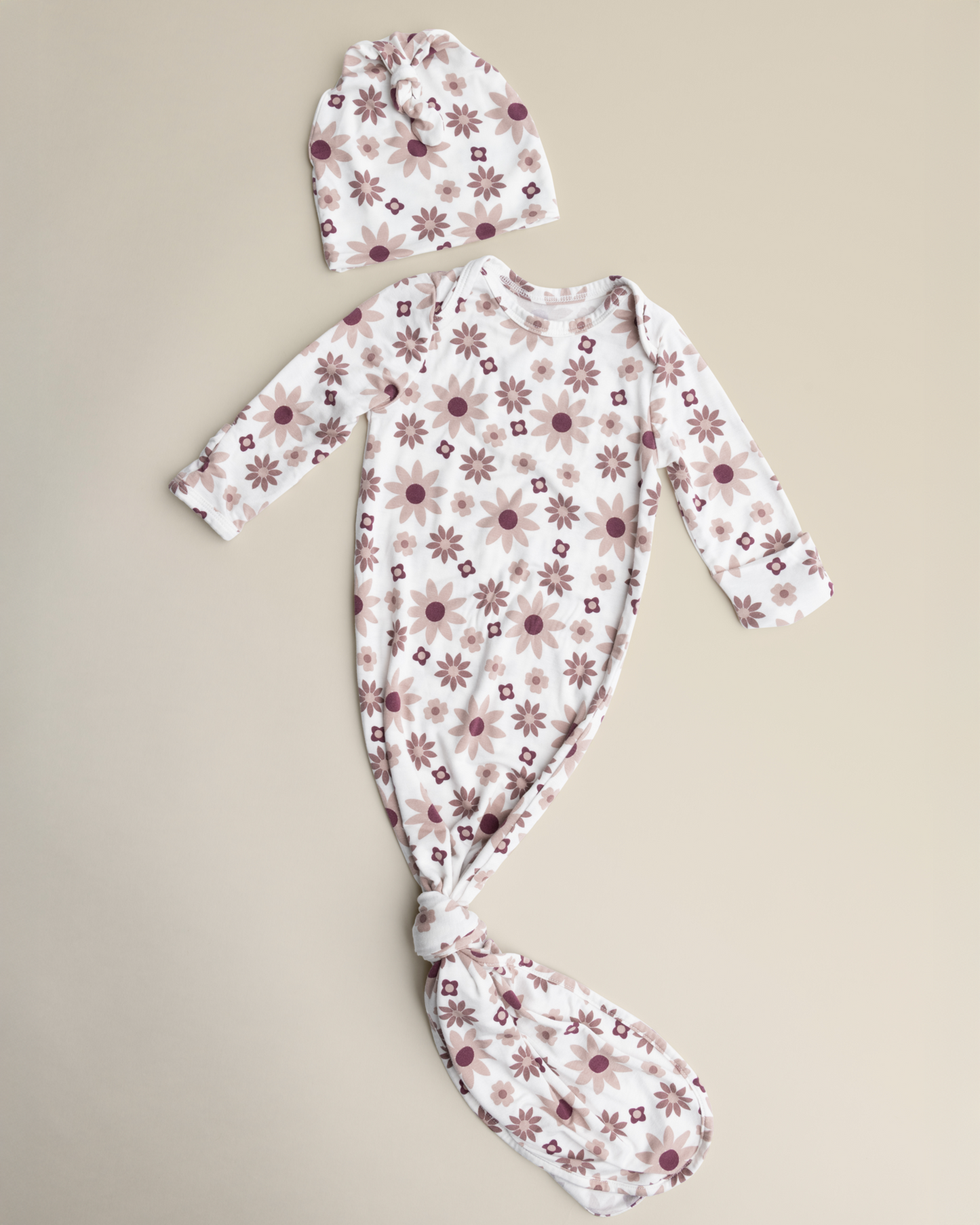 Bamboo Knotted Baby Gown in Twilight Floral set with floral pattern on a beige background
