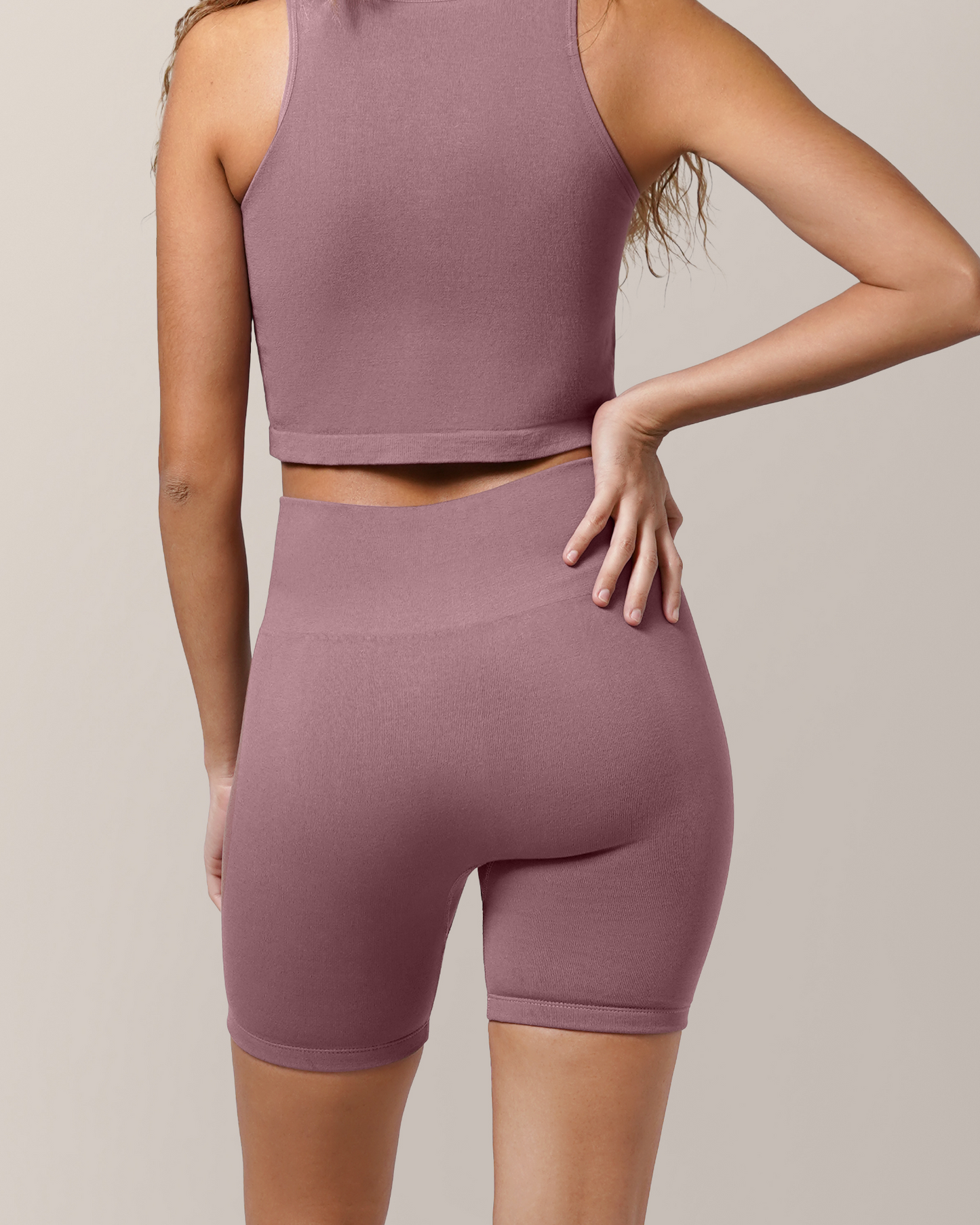 Back view of model wearing the Sublime® Bamboo Maternity & Postpartum Bike Short in Twilight paired with matching Sublime® Bamboo Hands-Free Pumping Longline Bra Top