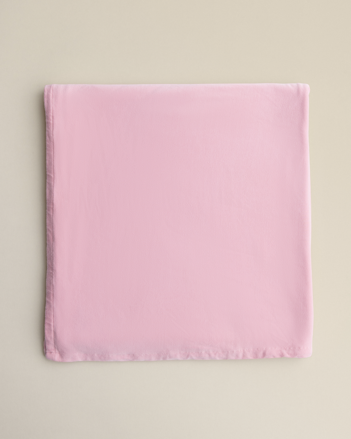 Bamboo Swaddle Blanket in Light Mauve on a beige background