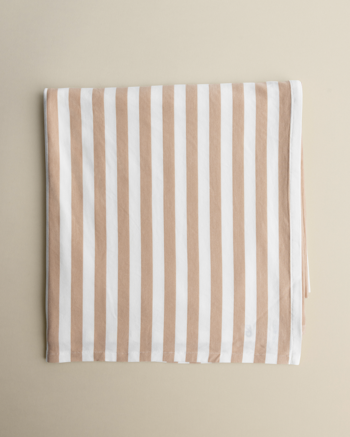 Bamboo Swaddle Blanket in Fawn Stripe on a beige background