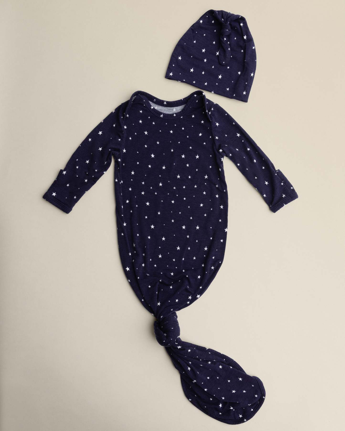 Bamboo Knotted Baby Gown in Navy Stars on a beige background