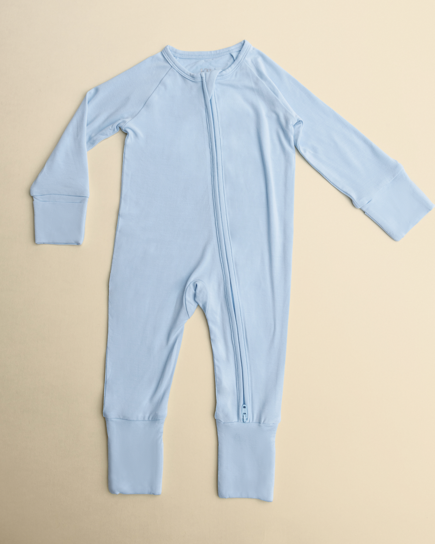 Bamboo Baby Pajamas in French Blue on a beige background