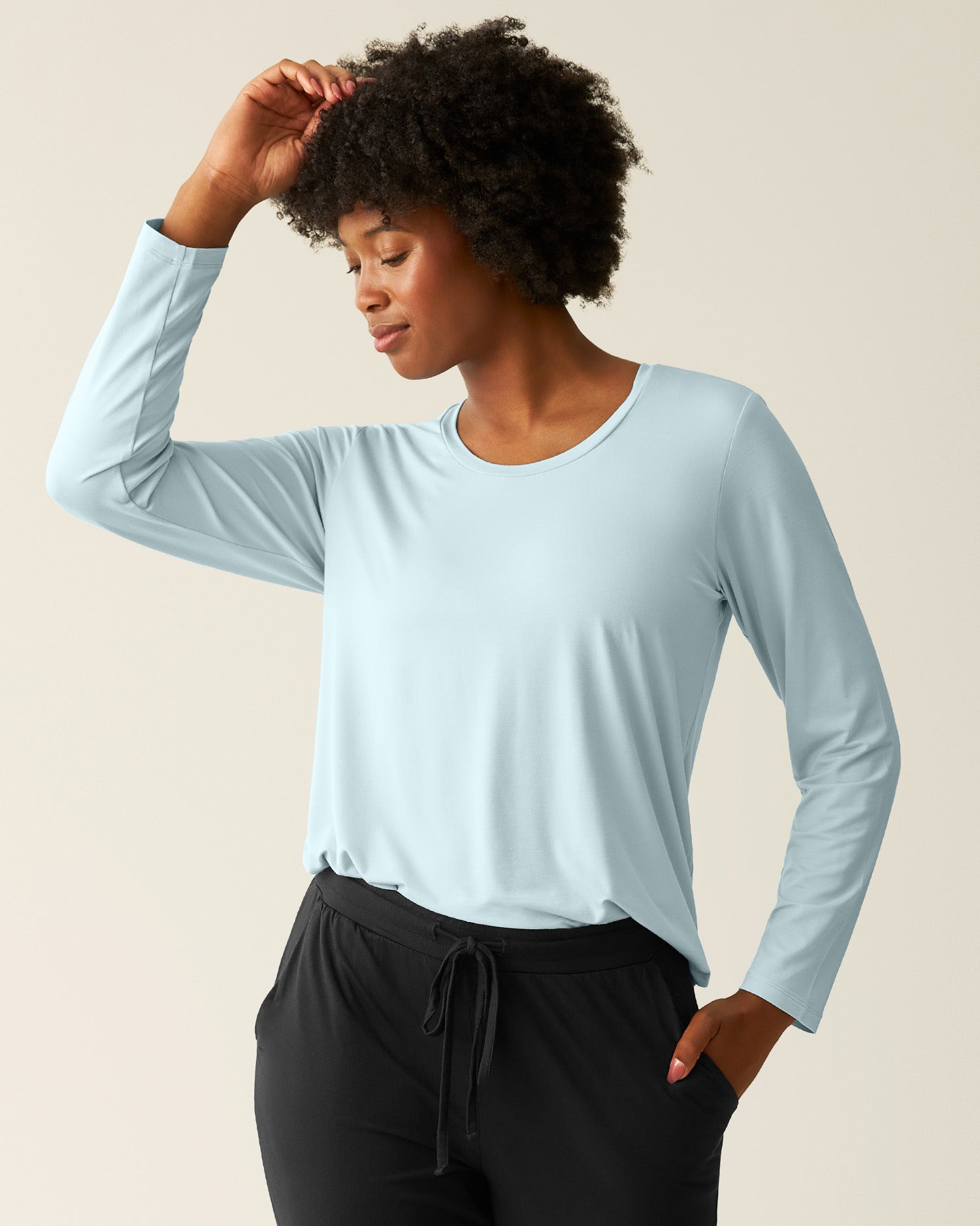 Woman wearing the Bamboo Maternity & Nursing Long Sleeve T-shirt in Powder Blue, tucked in @model_info:Kyra is wearing a Small.