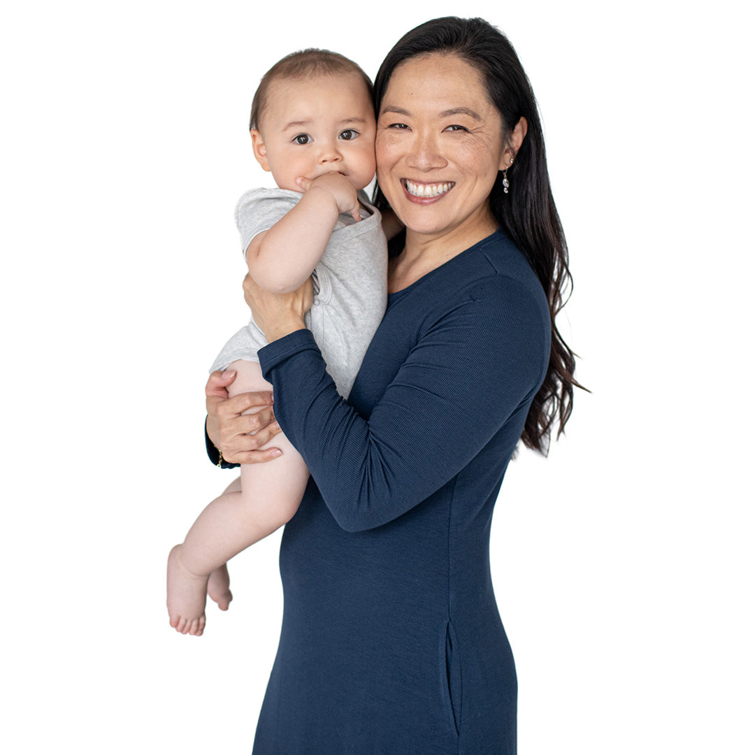  Model smiling with her baby wearing the Betsy Ribbed Bamboo Maternity & Nursing Nightgown