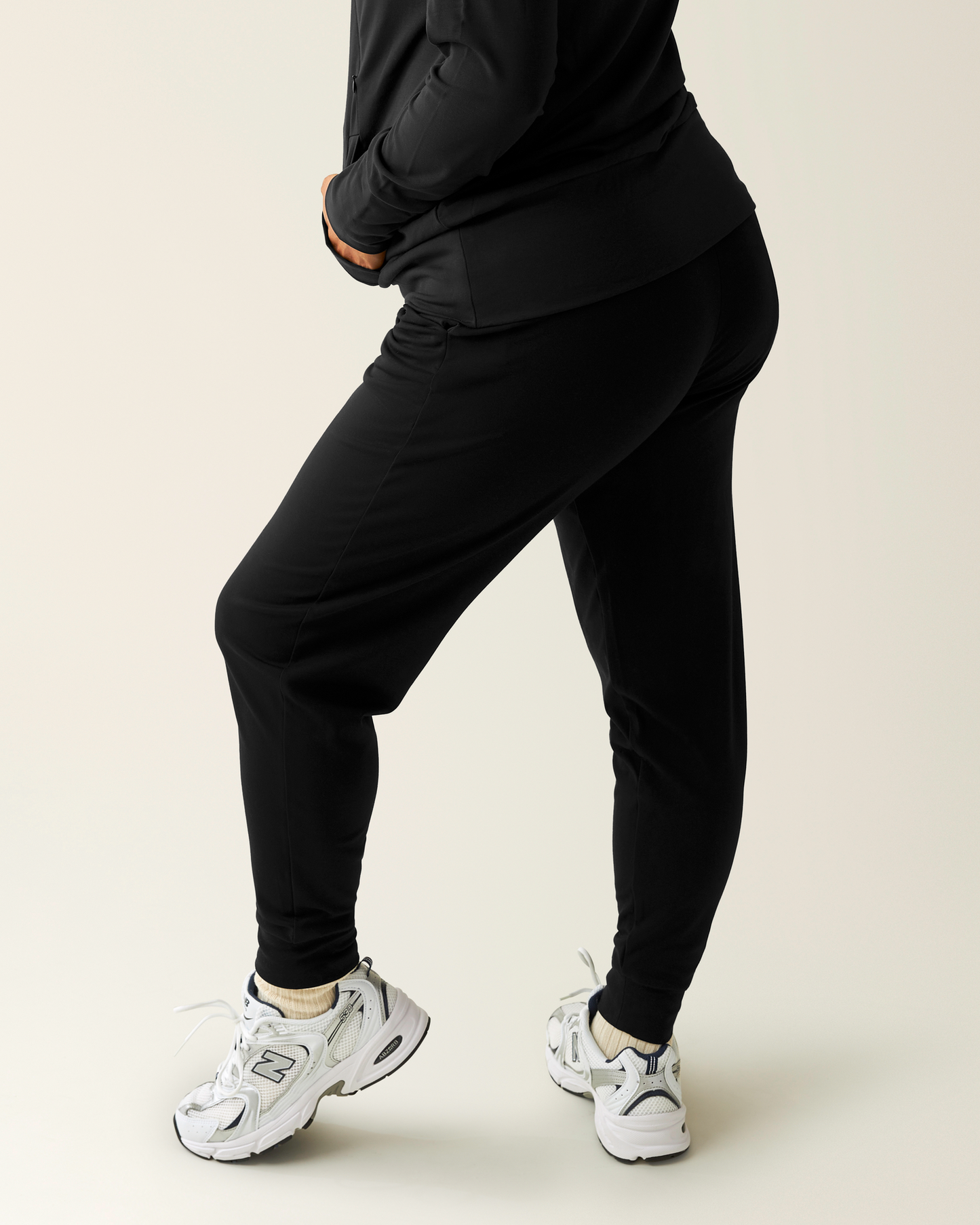 Side view of model wearing Brushed Bamboo Maternity & Postpartum Jogger in Black
