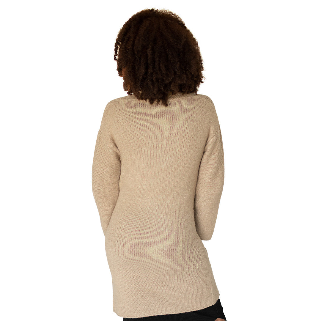 Back view of a model wearing the Chloe Cardigan Sweater in Oat